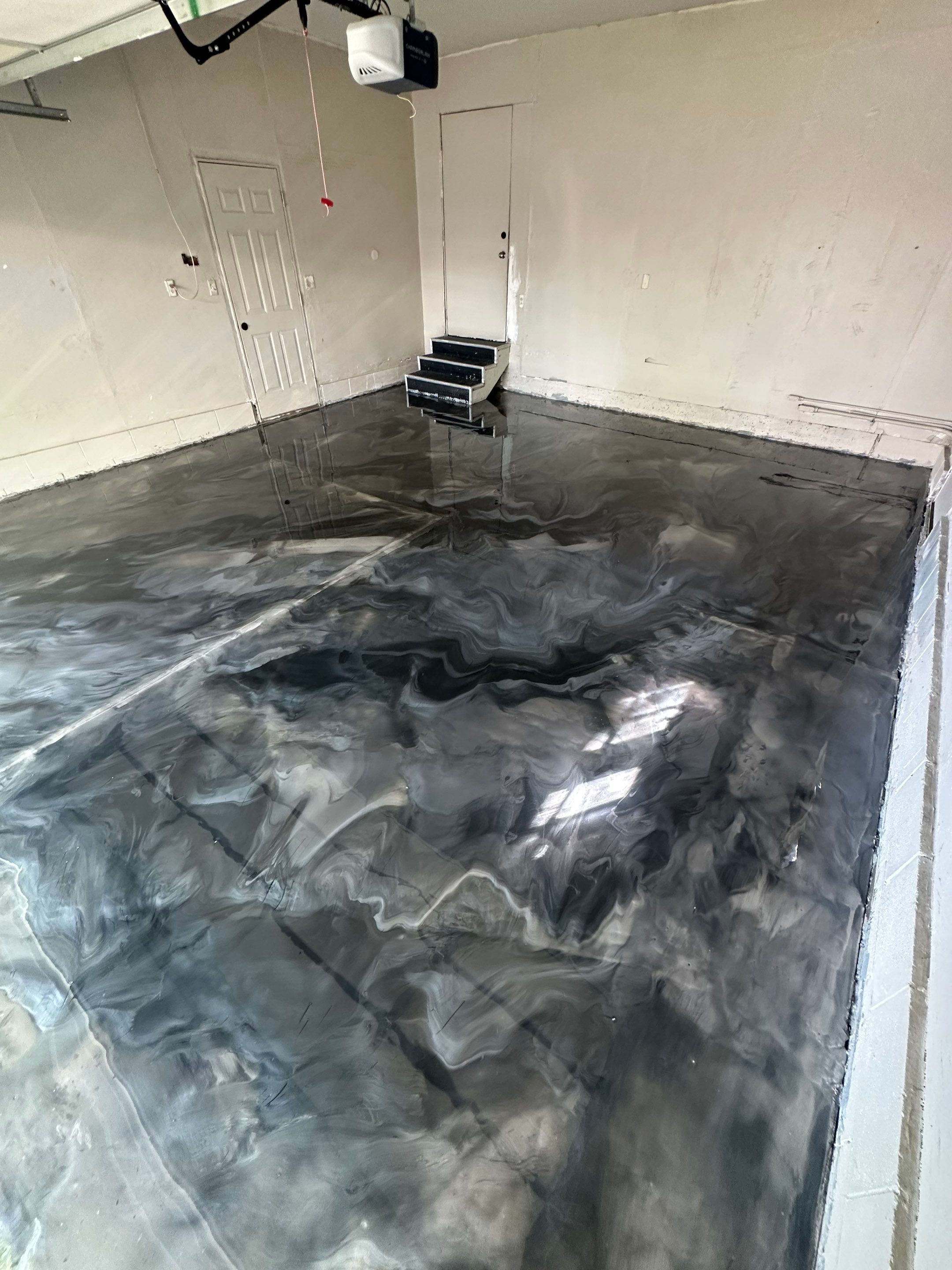High-Gloss Metallic Epoxy Garage Floor Transformation in Lincoln by Goat Coatings