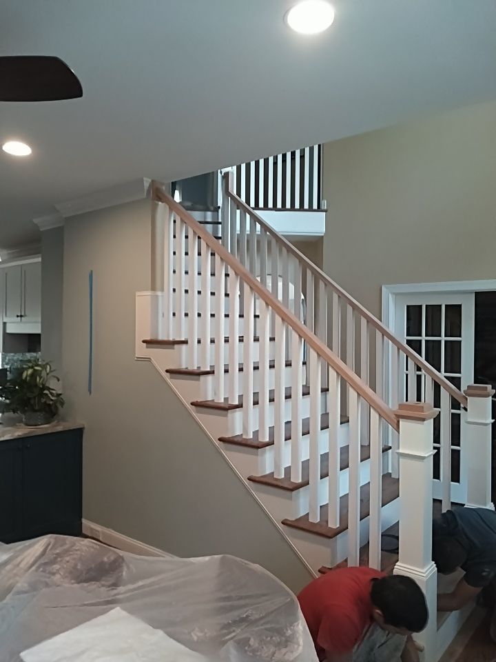 Stairway Installation using Red oak modern railings by House Custom Carpentry, LLC
