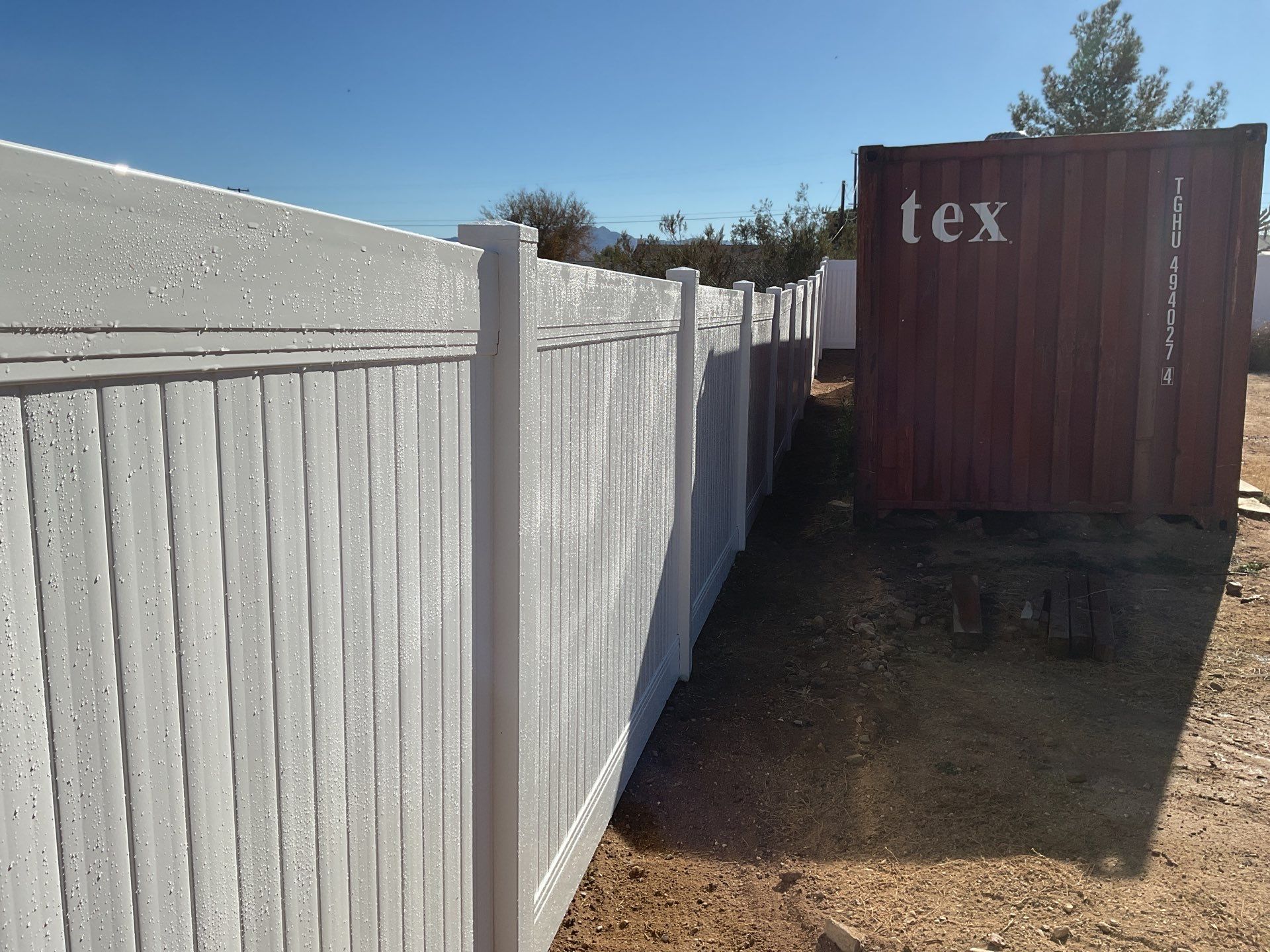 Fence Installation using vinyl and chain link  by Fence Guys Inc. 