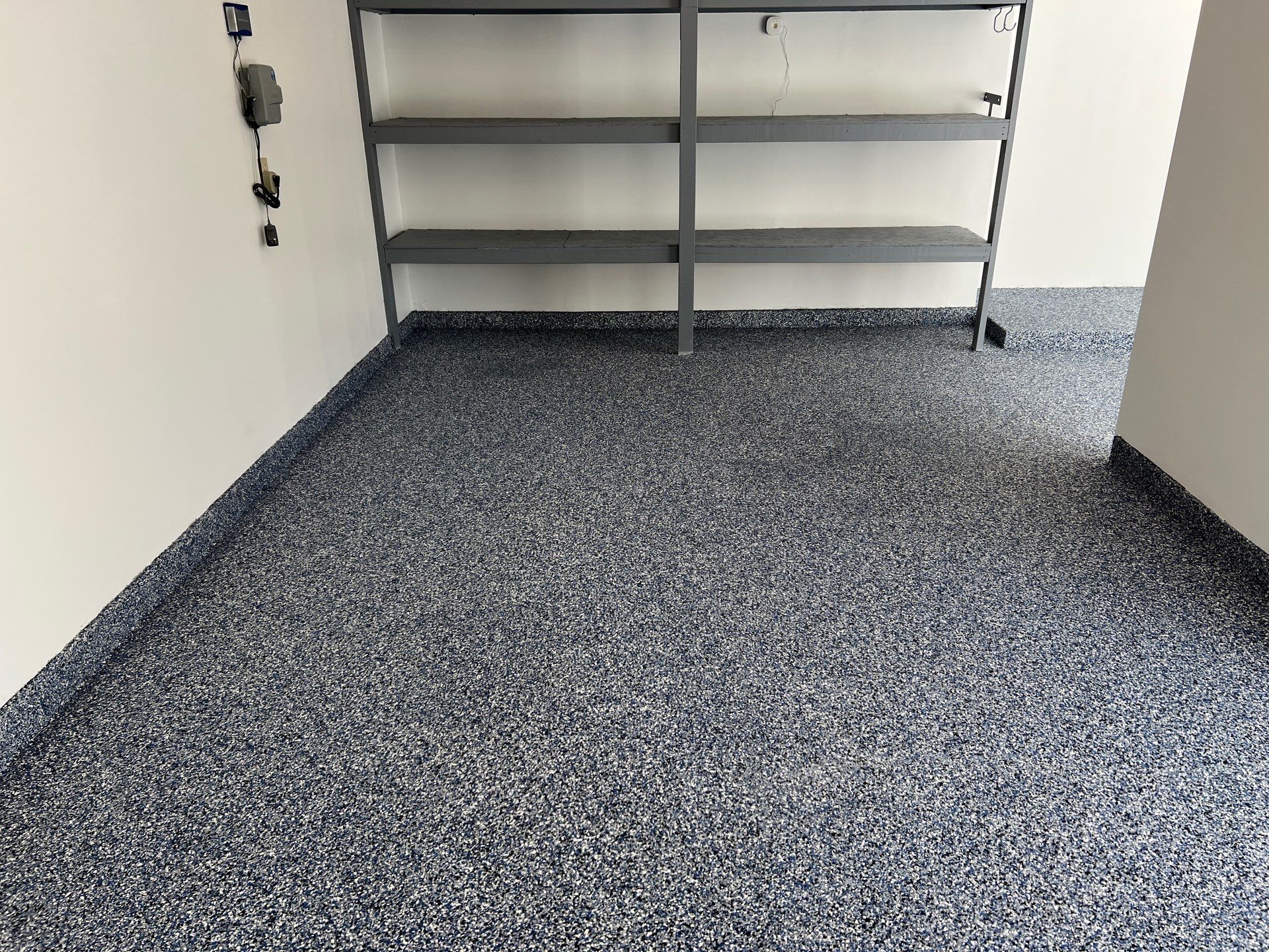 Custom Epoxy Flake Floor and Garage Wall Renovation in Ada by Gordon Painting