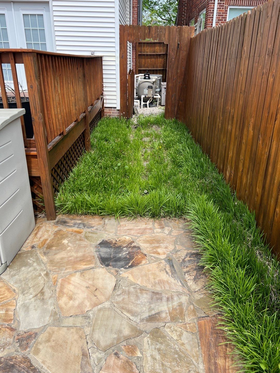 Liriope grasses, mulch and stone pavers by GrassBusters, Inc.