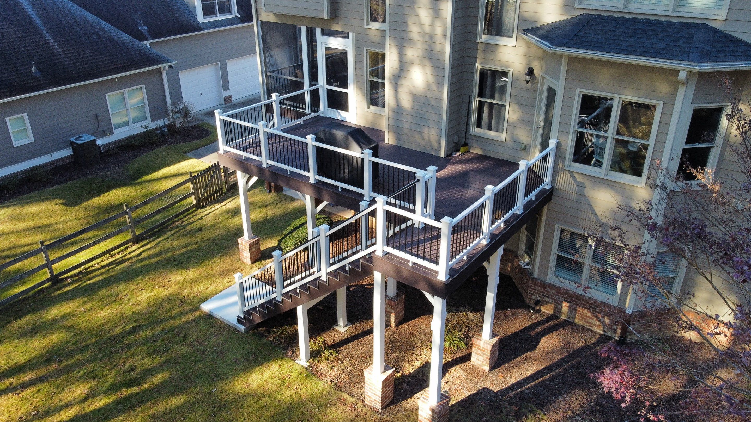 Multi-Level Composite Deck and Screened Porch in Acworth by Swift Home Renovations 
