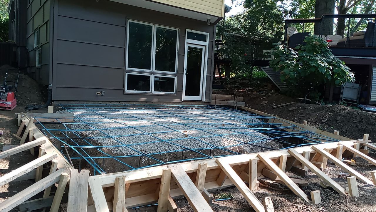 Back Yard Cantilivered Patio by LAND ESCAPES LLC