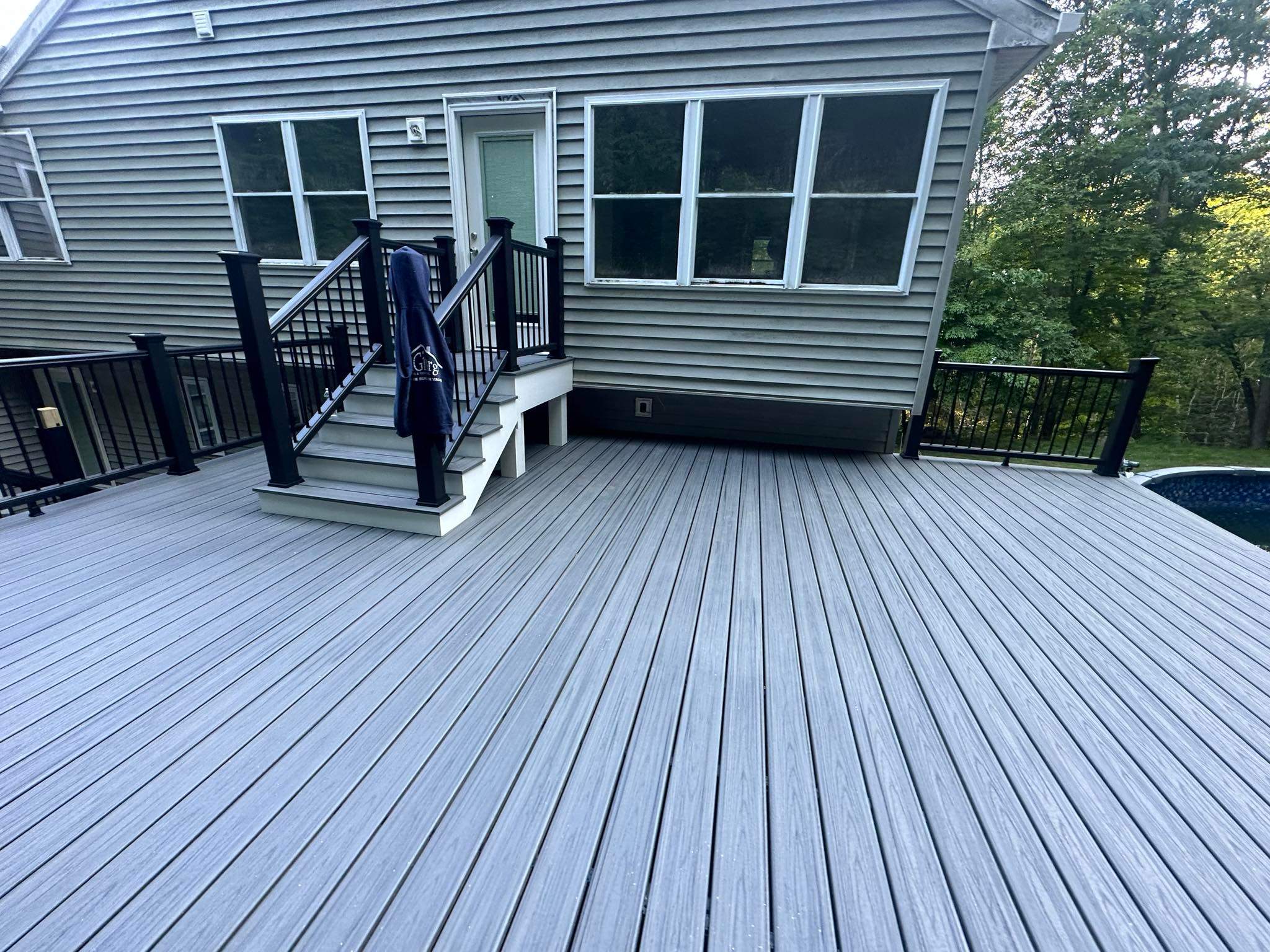 Pool Deck replacement, Trex Tropical Island Mist , Black Transcend railing. by DiGiorgi Roofing and Siding Inc