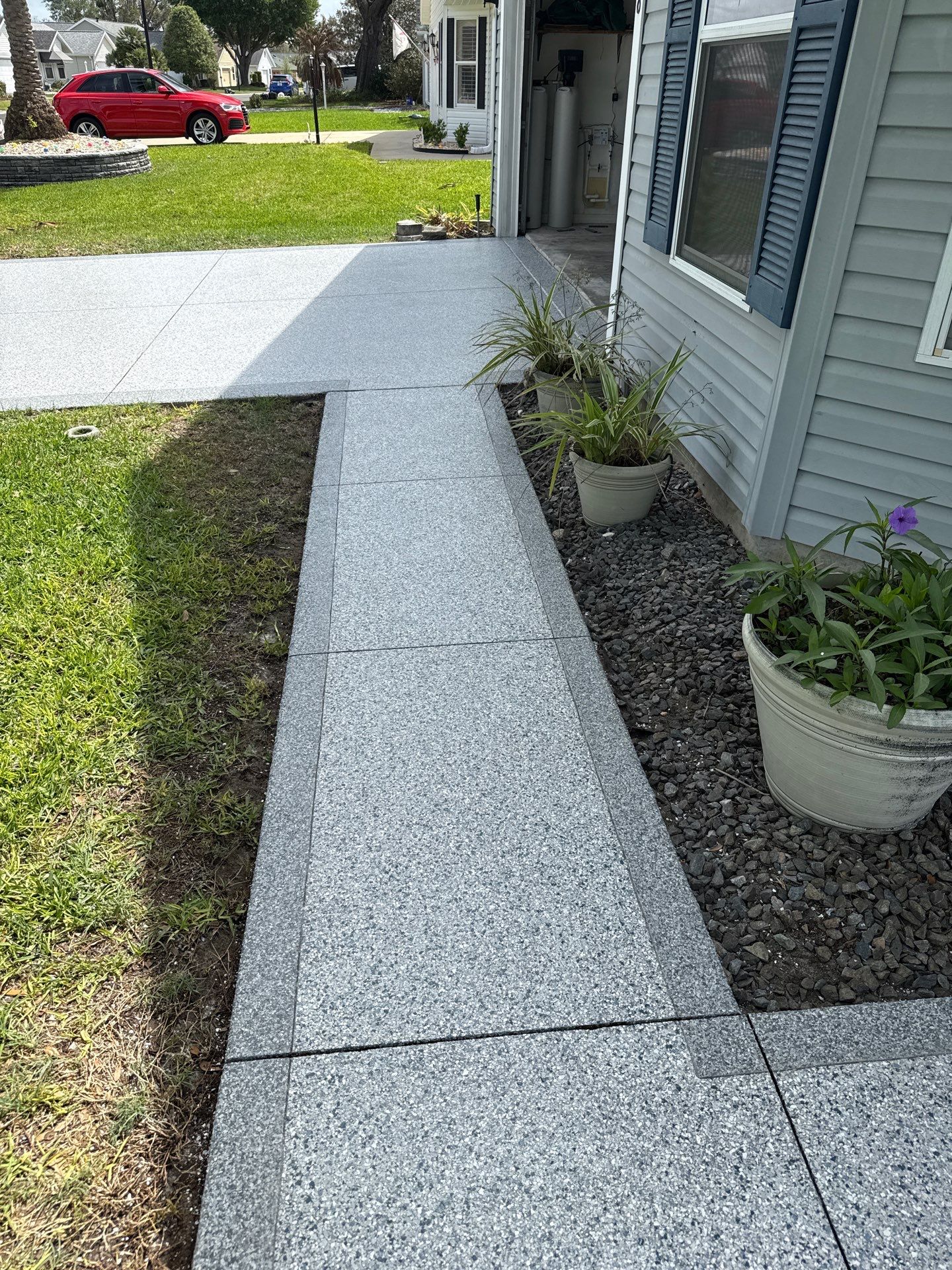 Driveway Tidal Wave with Cool Breeze Border and Sidewalk by Innovative Concrete Coatings 