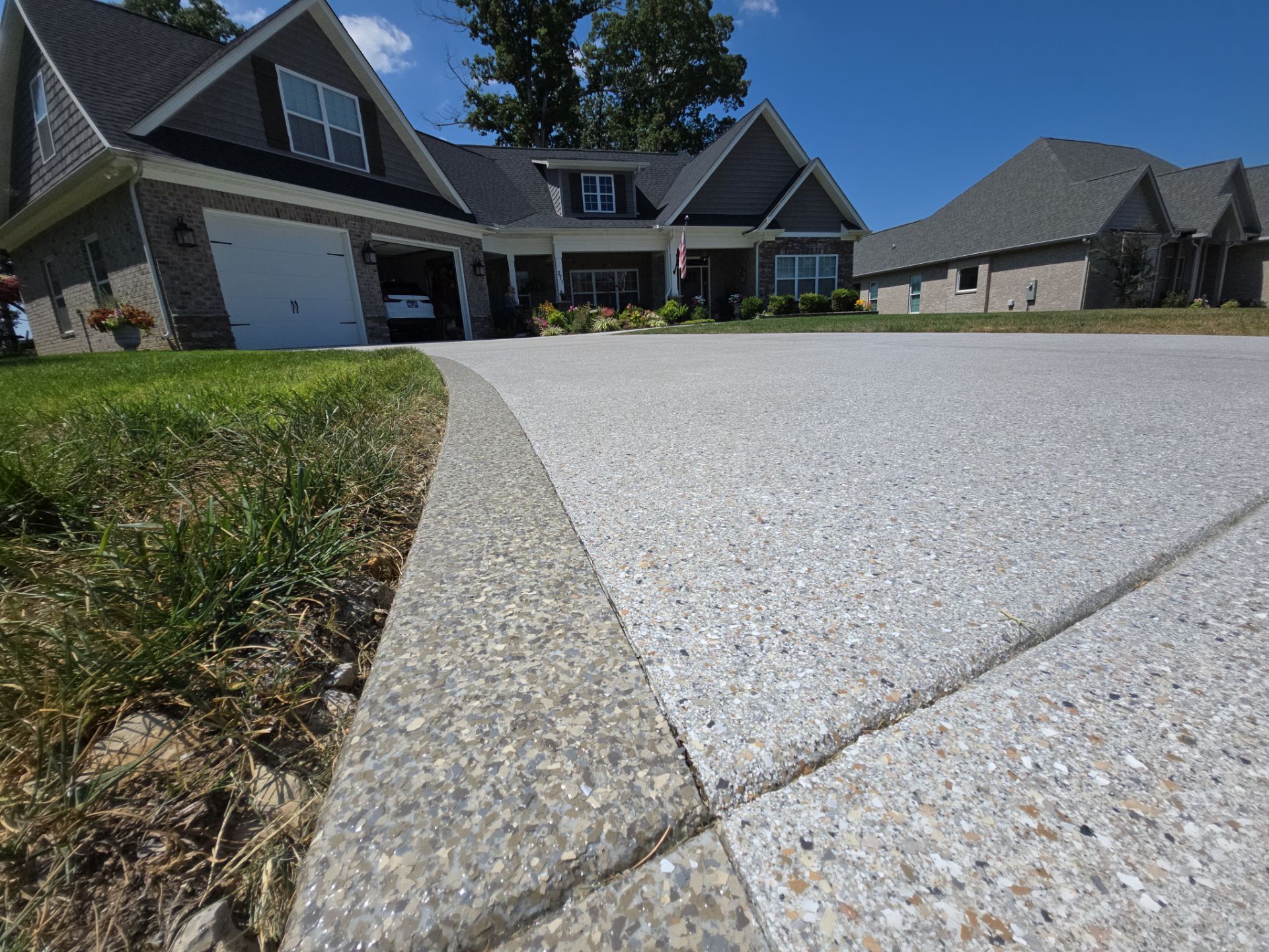 Driveway Improvement Using Claystone With Trail Mix Border! by Elite Floor Solutions