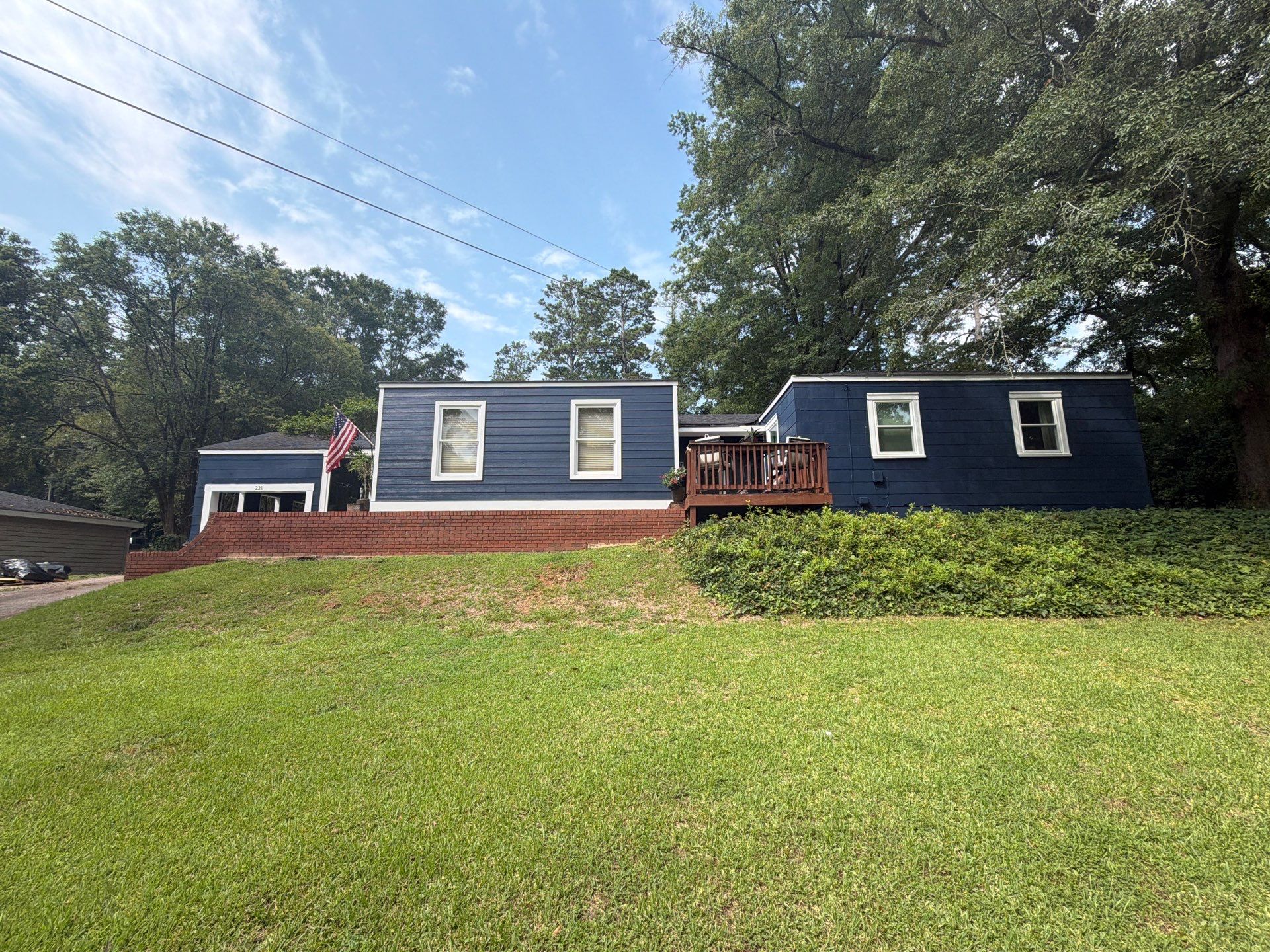 Full Exterior Repaint with Navy Blue and White Trim by Swift Home Renovations