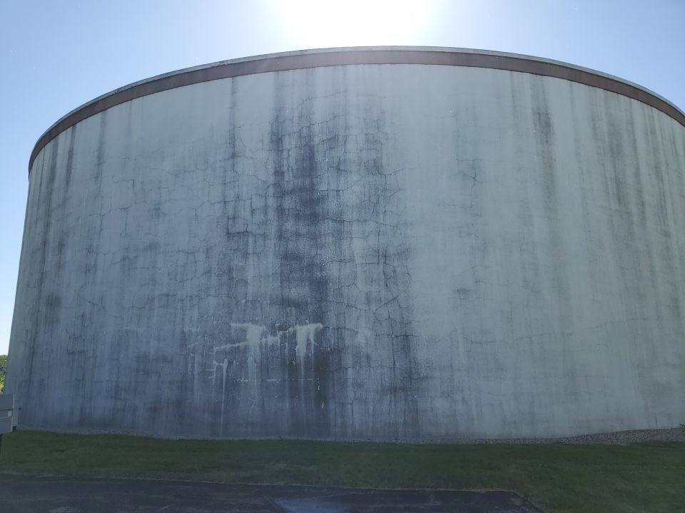 Water tank cleaning by Northern Power Washing LLC.
