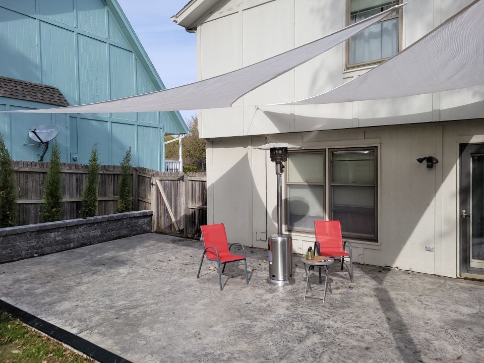 Back Yard Stamped Concrete Patio by LAND ESCAPES LLC
