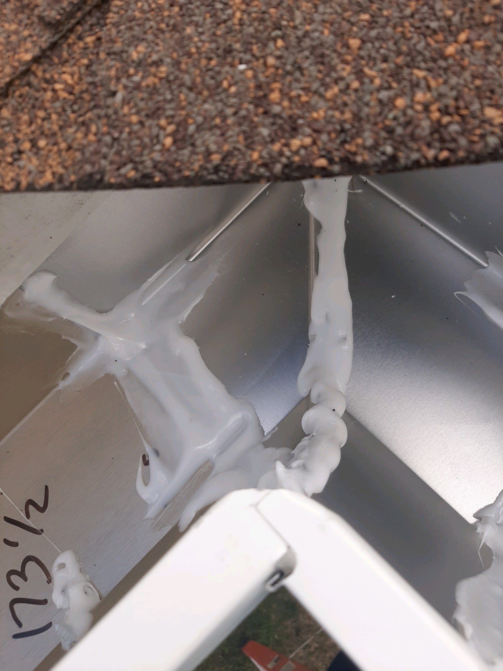 Gutter Installation using White Seamless Gutters by Gutter Professors