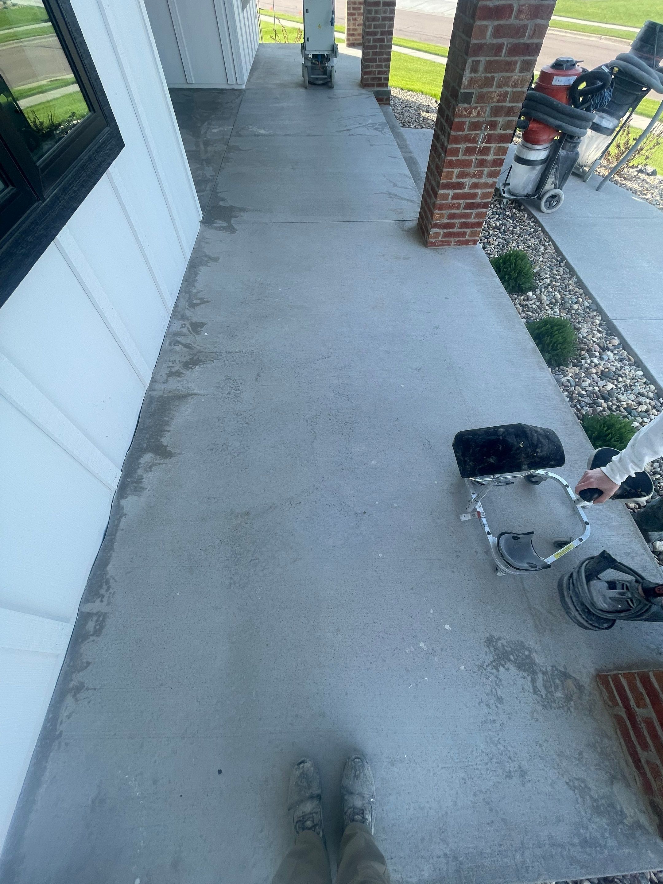Grey Speckled Concrete Porch Coating for Sioux Falls Home by Select Painting, Coatings & Garage Cabinets