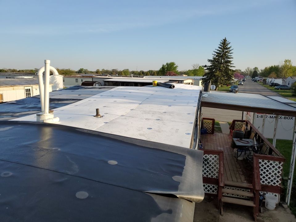 Residential Roofing Installation using 60 mil rubber roof  by Nitro Roofing and Construction