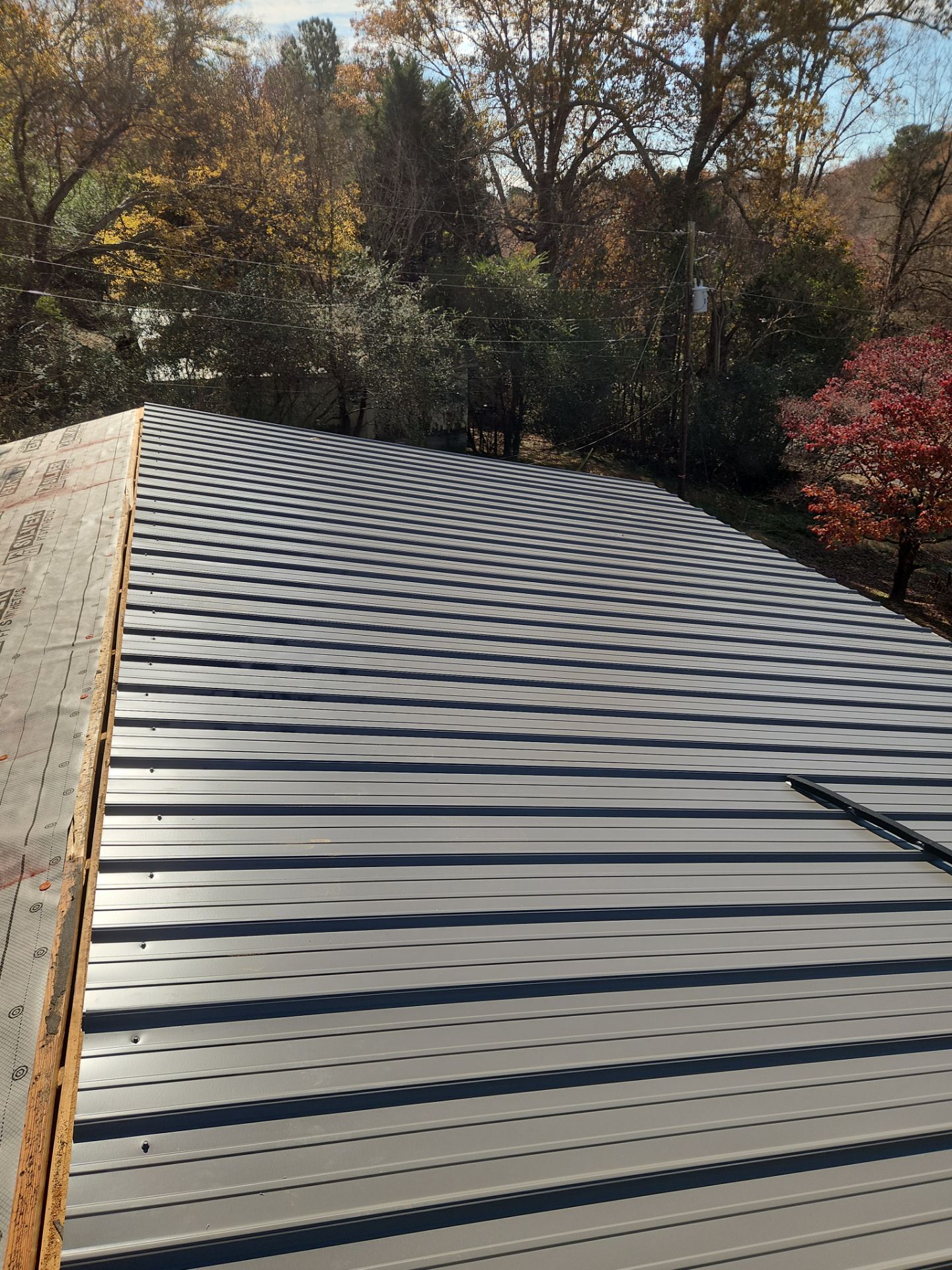 Roof Replacement in Pinson (Metal Roof) by The Roofing Dudes
