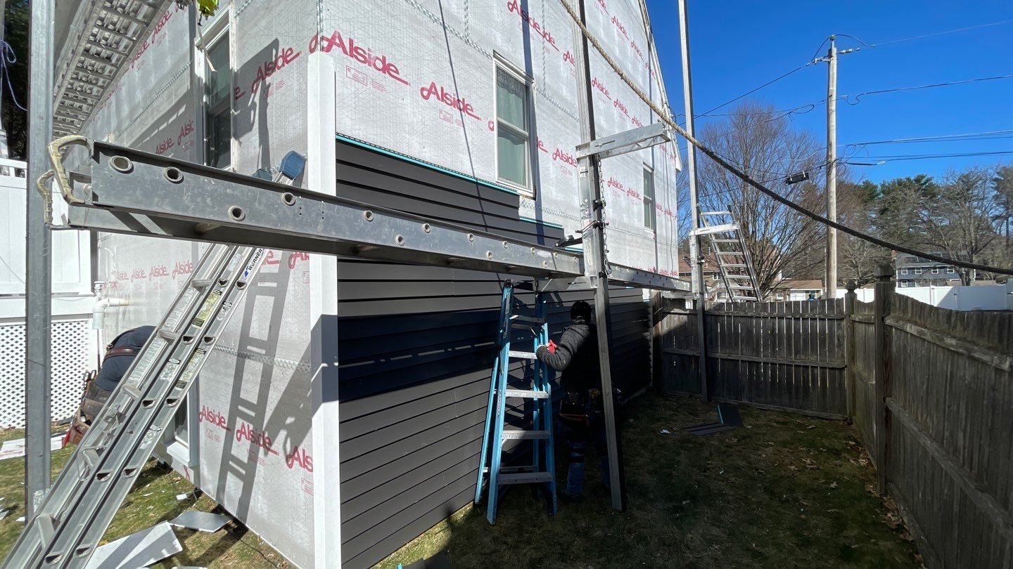 Complete Exterior Renovation with New Siding & Gutters   by Sensible Home Solutions