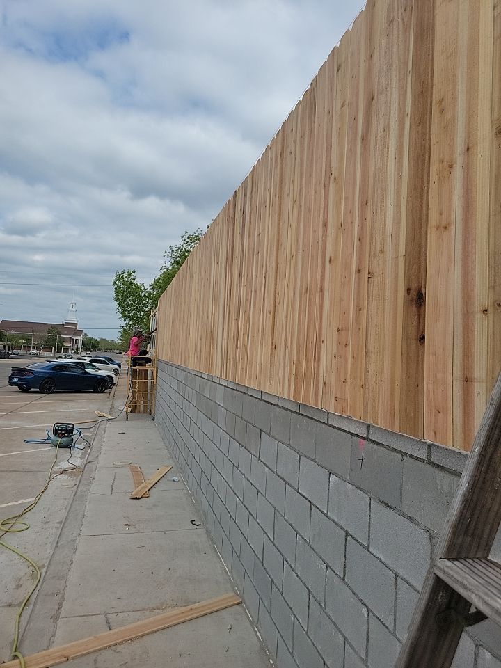 Cedar Fence using Cedar Pickets and Metal Poles by Clays Services Inc