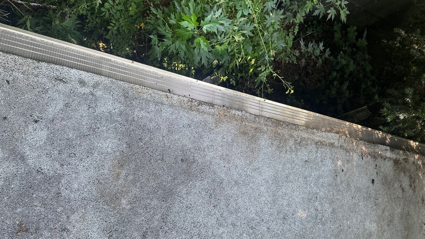 Very overdue gutter cleaning and screening by Above All Gutters 