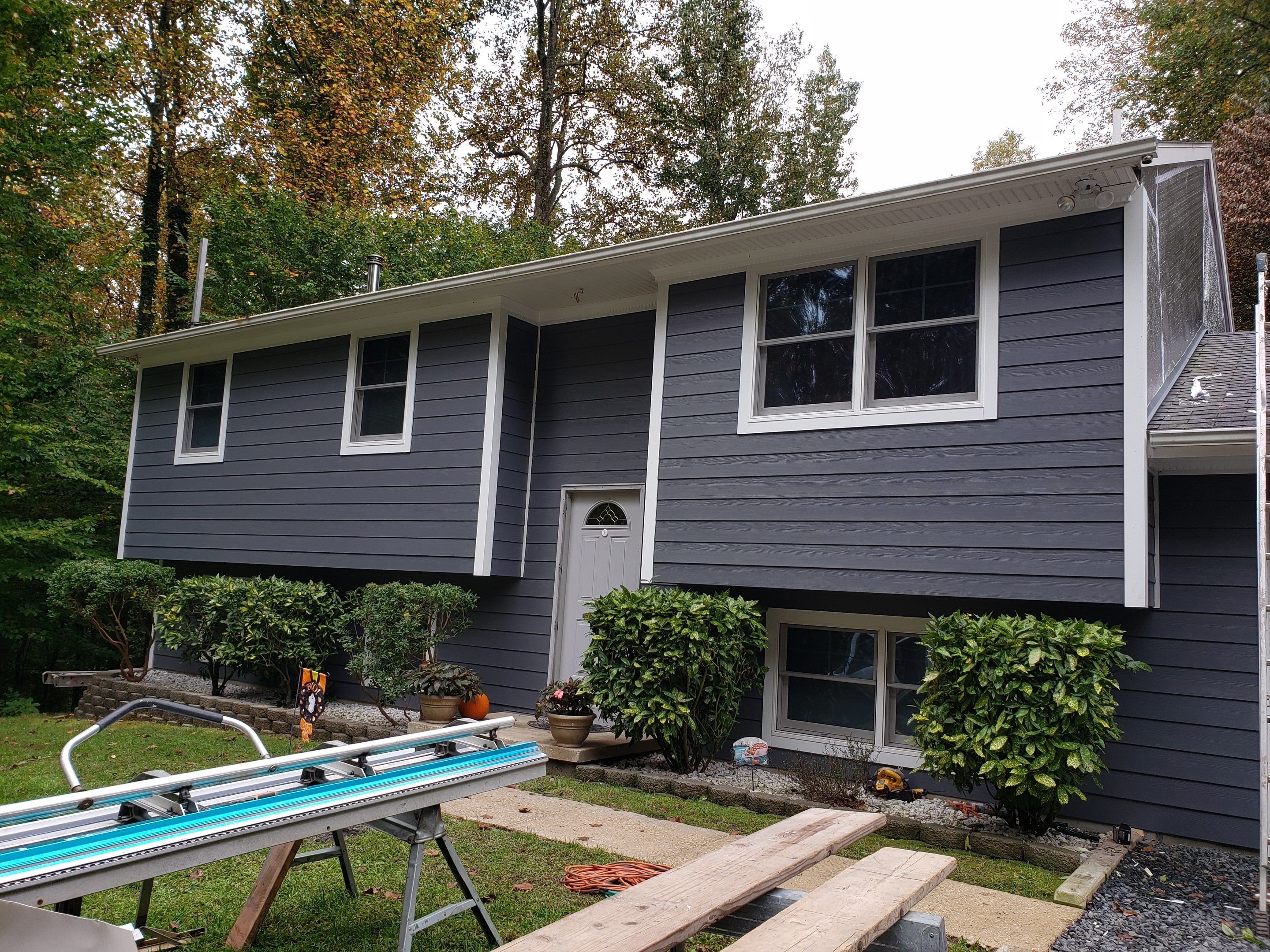 New James Hardie siding in Night Gray and Arctic White trim with LowE Wrap by Window Depot of Annapolis