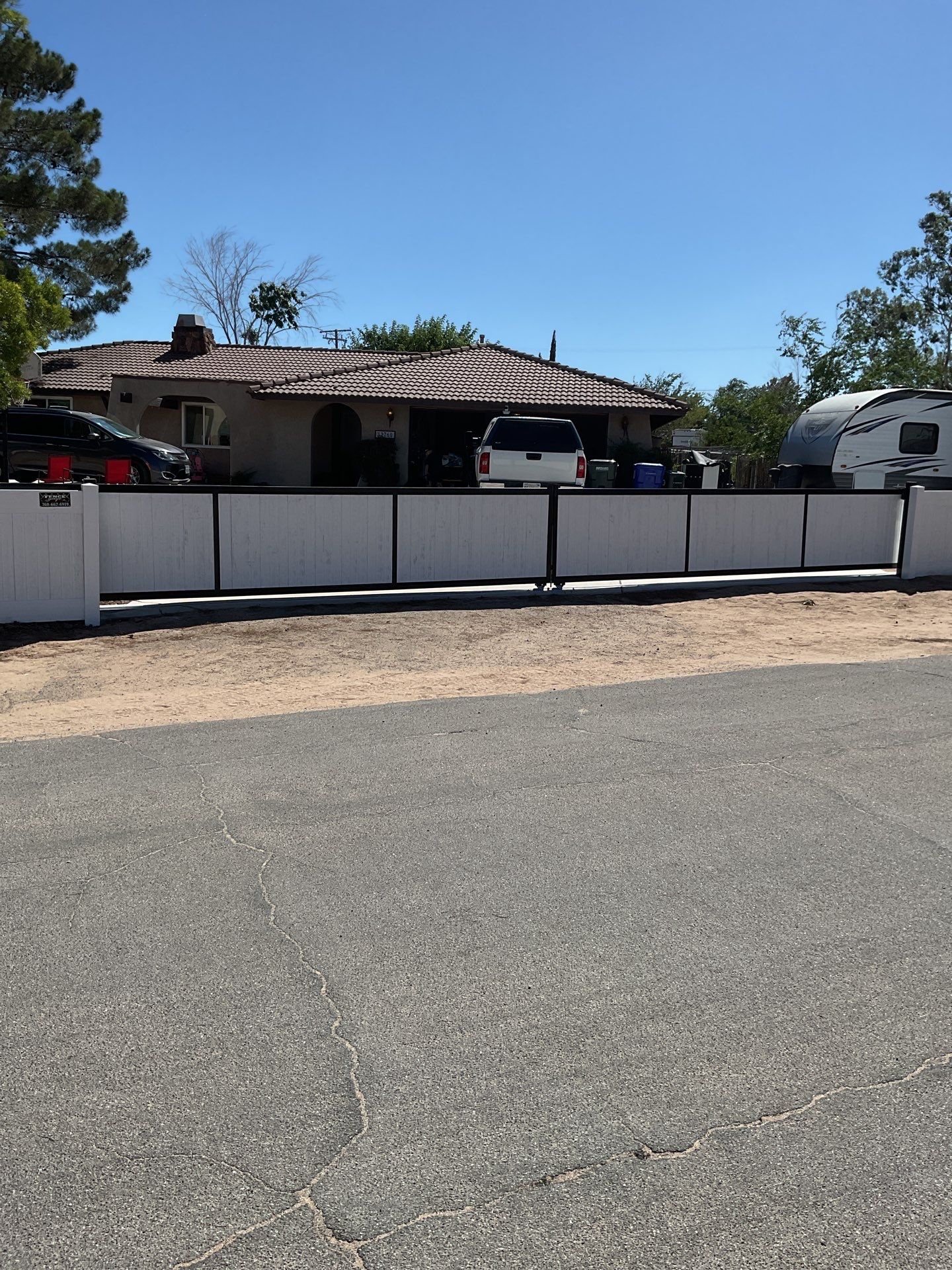 4ft White Vinyl Fence with Solar Power Motorized Gate by Fence Guys Inc.