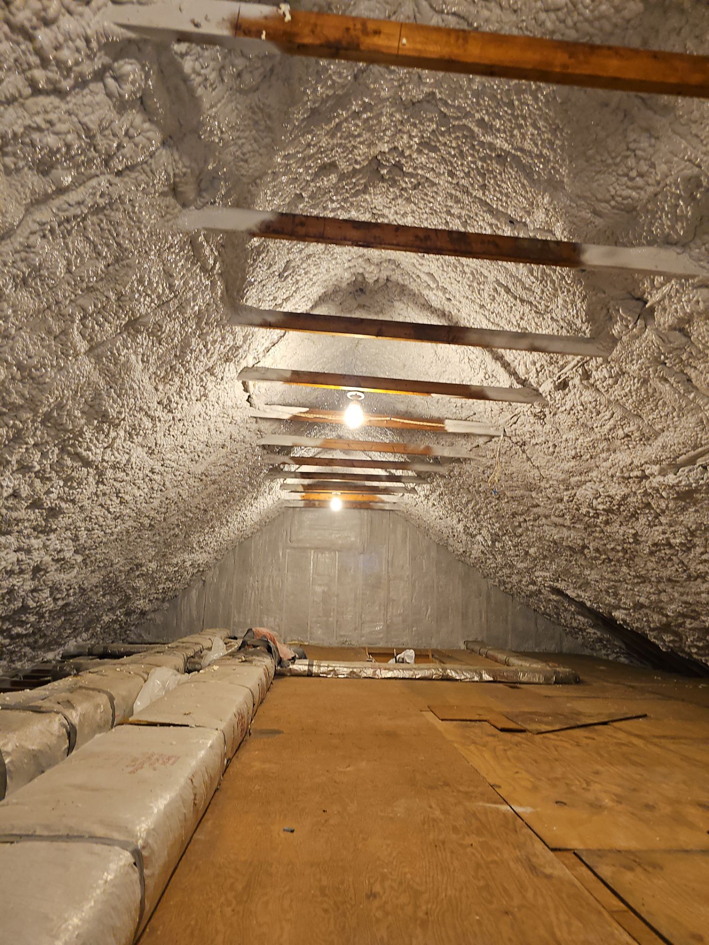 Attic Retrofit using open cell spray foam by NYS Foam & Energy