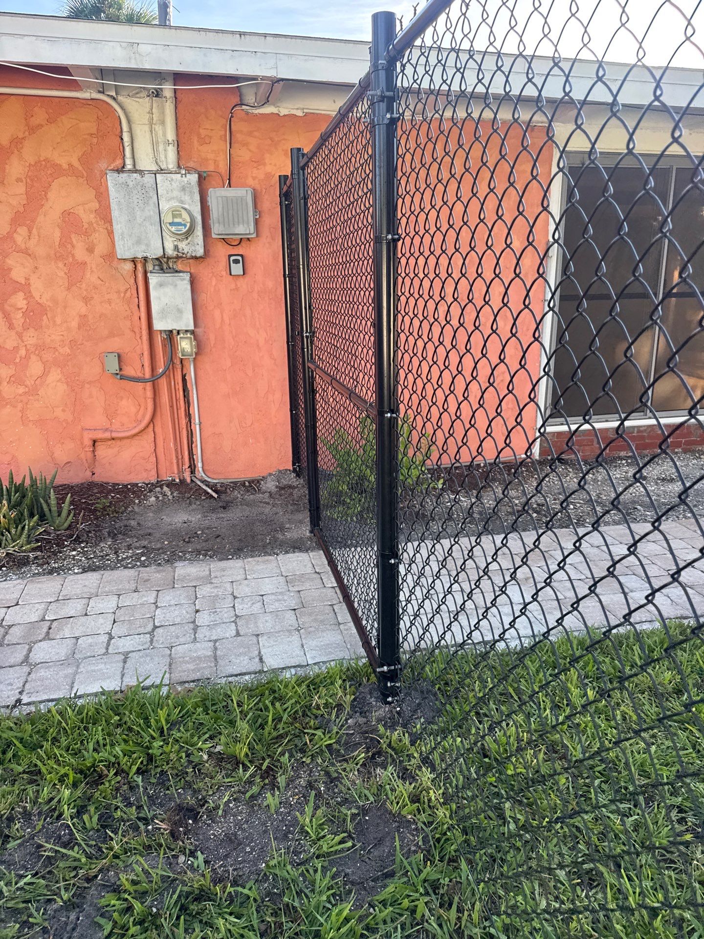 Black Chain Link Fence Installation and Site Clearing in Nokomis by True Fence LLC