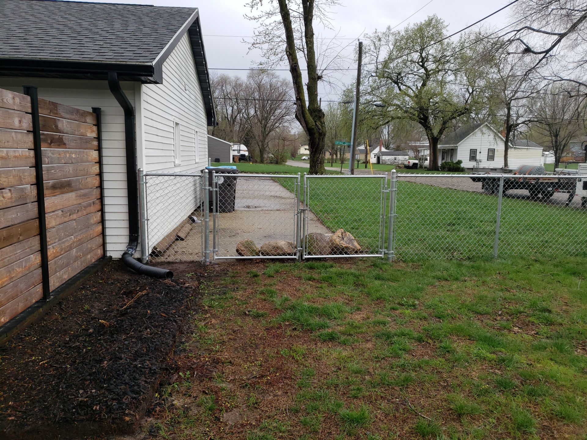 Galvanized Chain Link and Horizontal Wood Privacy Fencing in Waterloo by Perfect Picket Fence and Stain