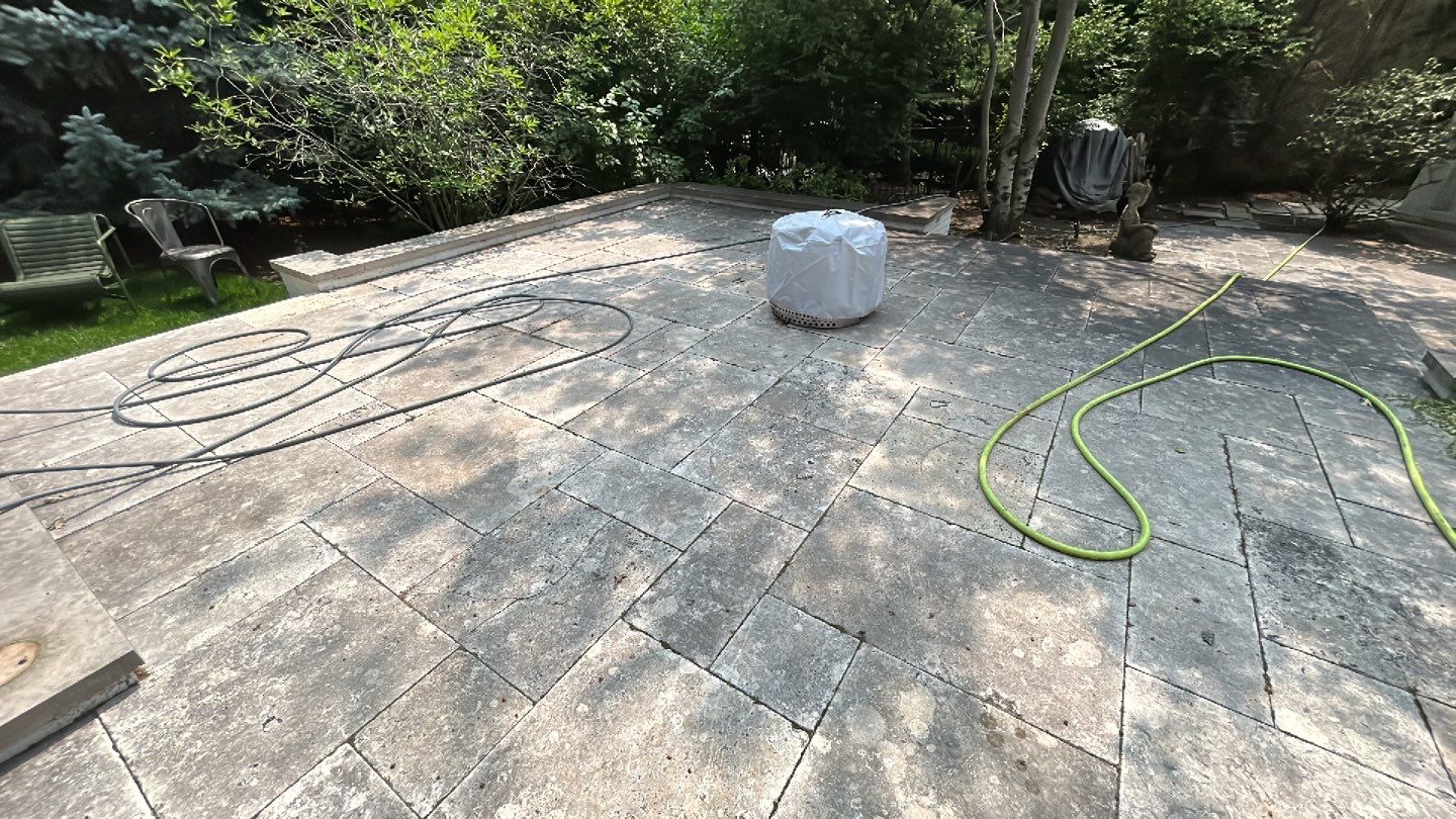 marble patio cleaning and sanding using Polysweep polymeric sand by Northern Power Washing LLC.