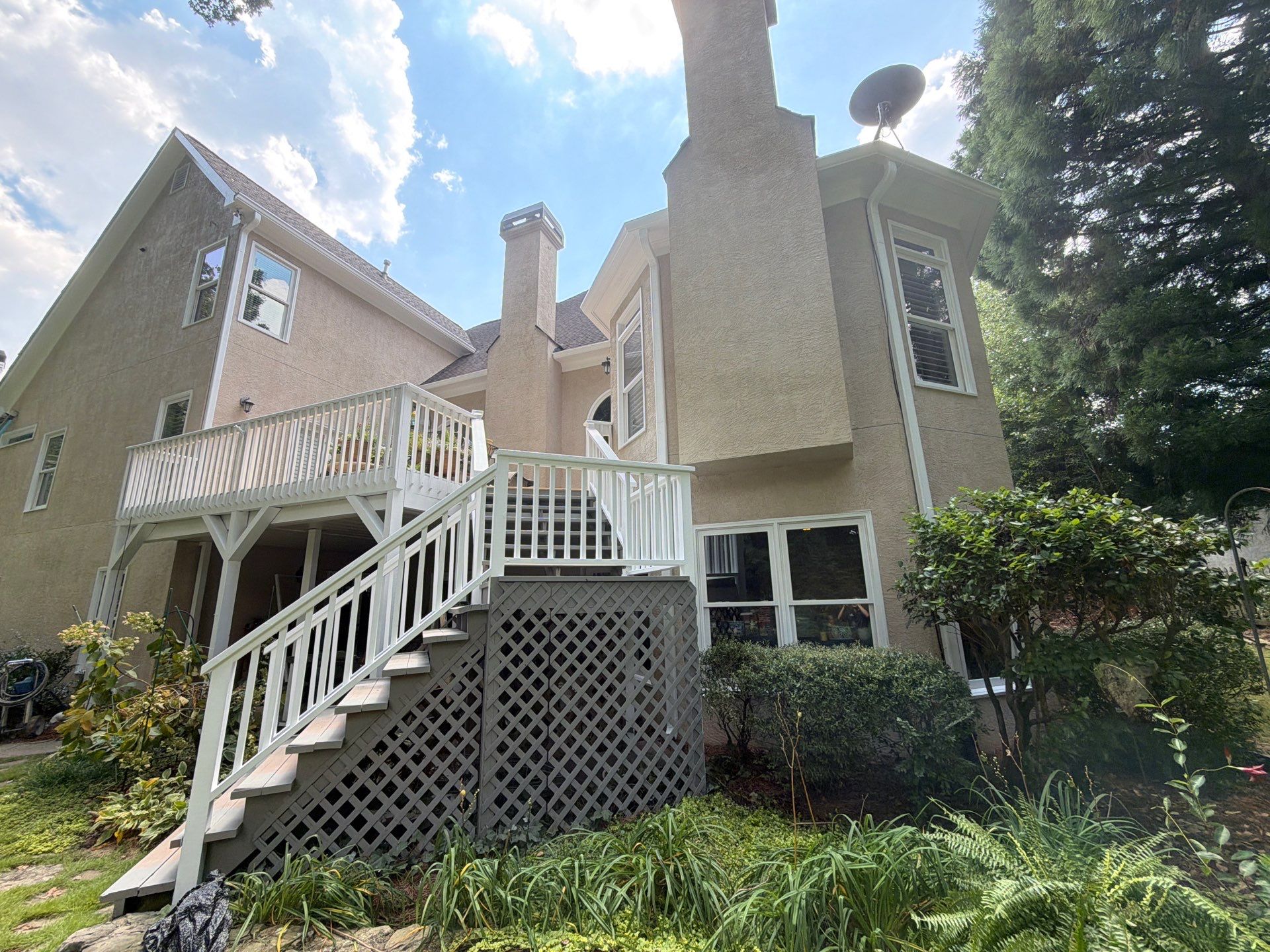 Multi-Story Stucco Home Exterior Painting and Garage Refresh in Marietta by Swift Home Renovations 