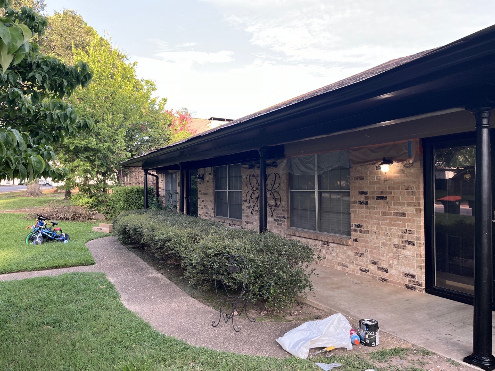 Exterior Painting in Tyler, TX | Eaves, Door & Columns in Elegant Black by Quality Coats Painting