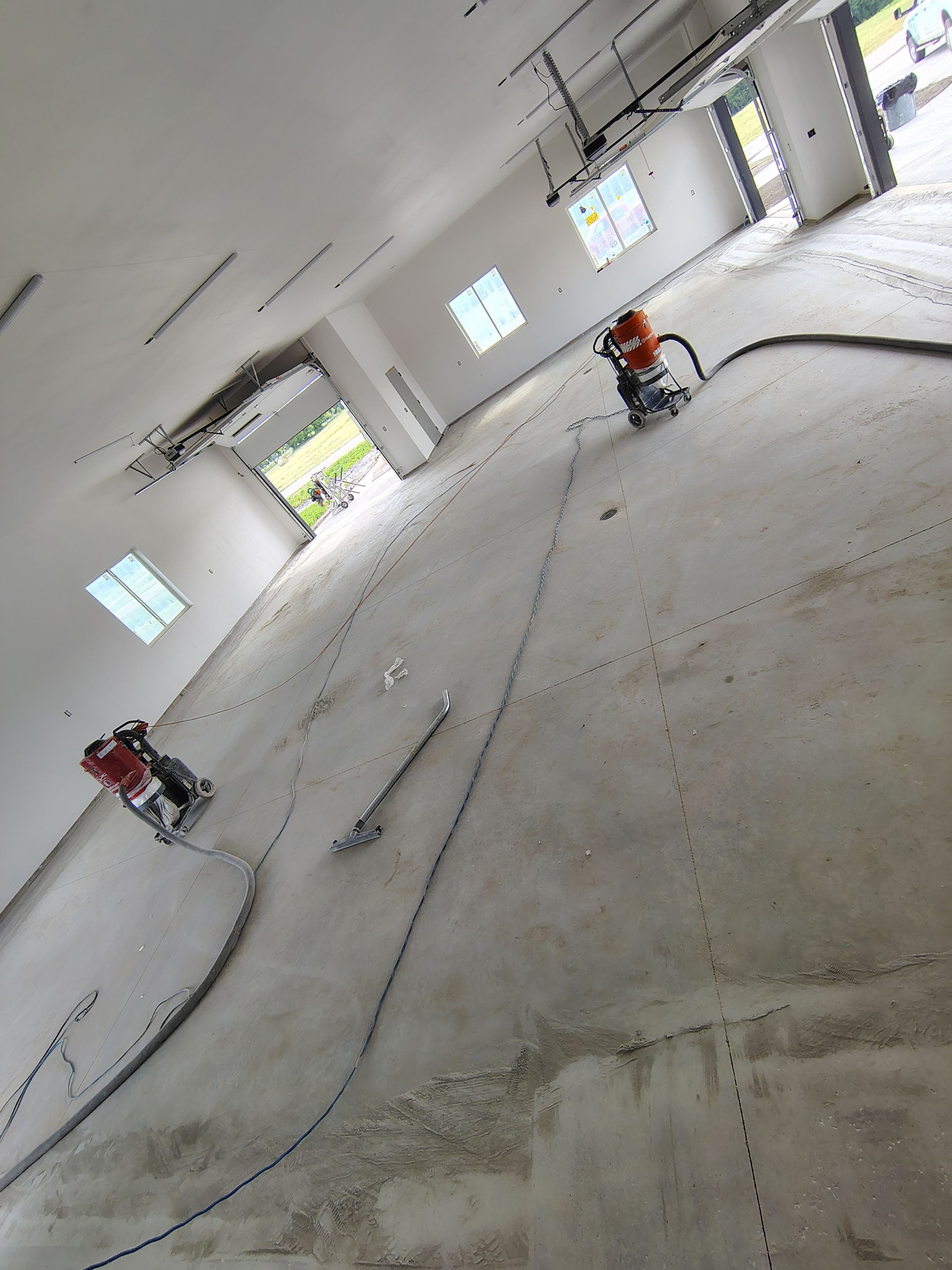 Multi-Bay Garage Concrete Coating and Floor Refinishing in South Dakota by Select Painting, Coatings & Garage Cabinets