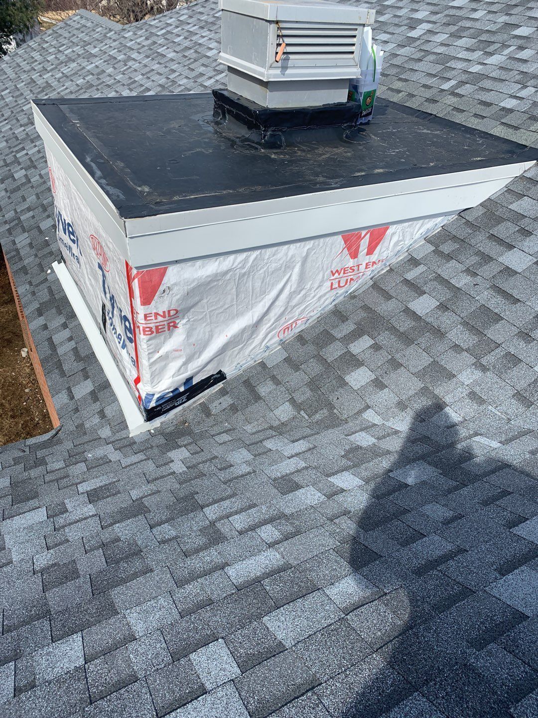 Commercial Roofing Installation using EPDM with white gutters by A Plus Exterior