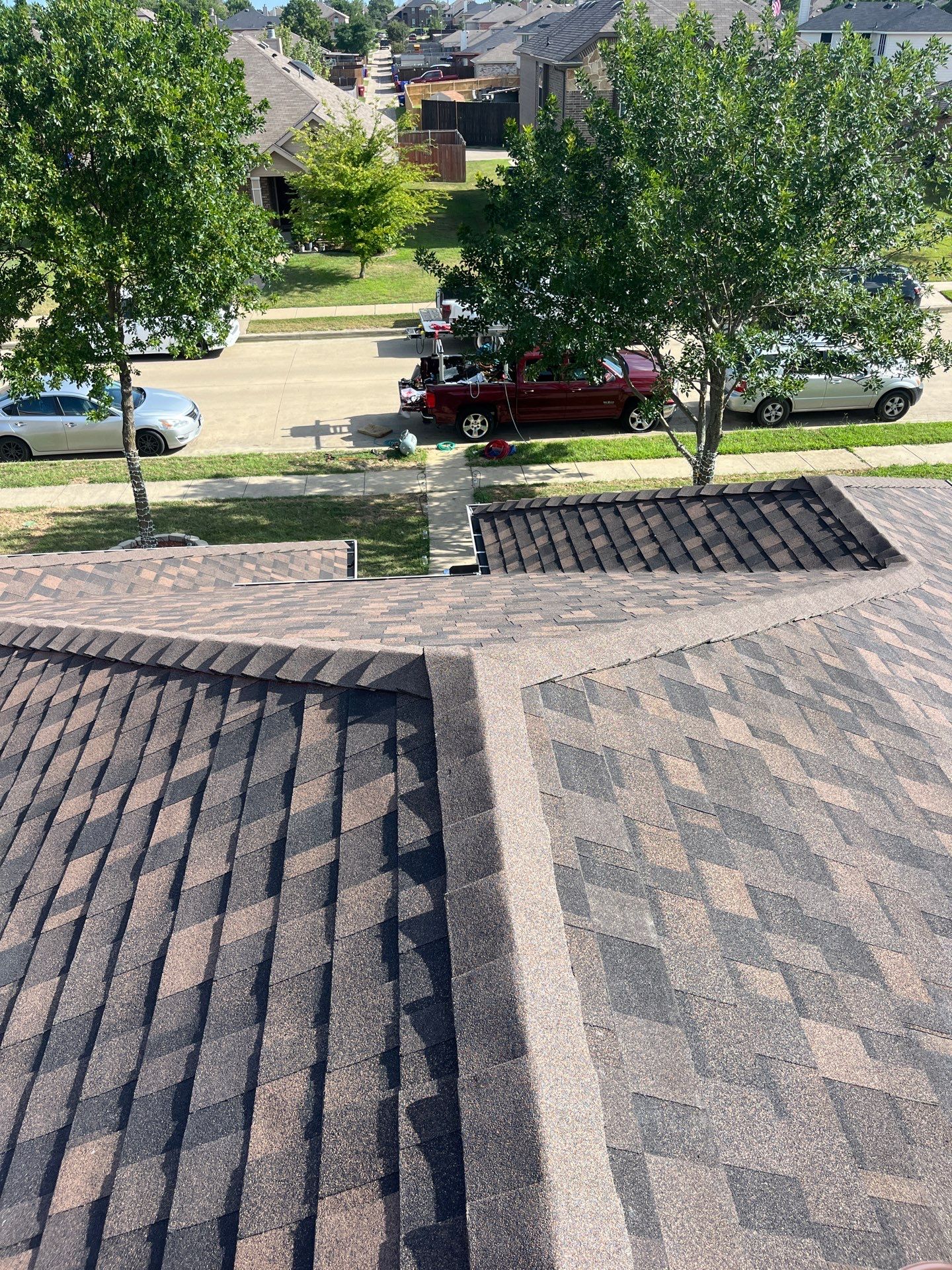 IKO Shadow Brown-Medium brown brick house by Tejas Roofworks + Restoration