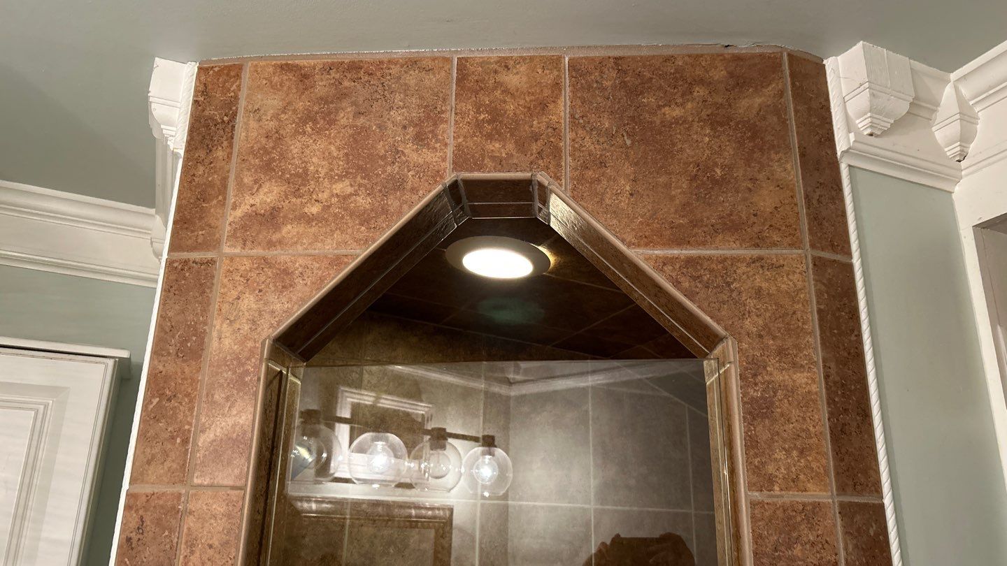 Tile shower and floor by Footprints Floors of Nashville