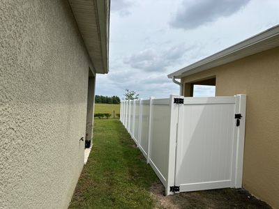 Aluminum Fence Installation using Vinyl Privacy Fence 