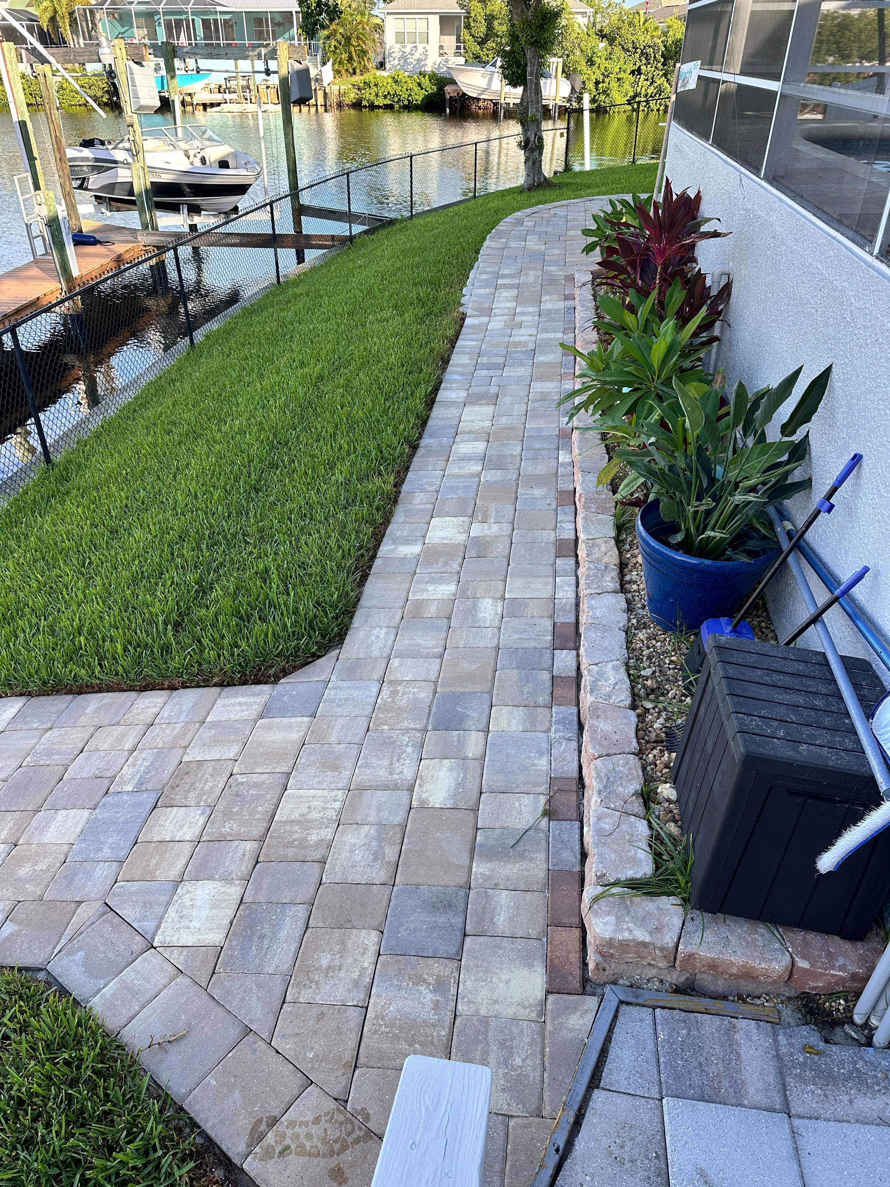 Travertine Sealing and Stripping for a Waterfront Pool Deck in Apollo Beach by Supreme Paver Experts