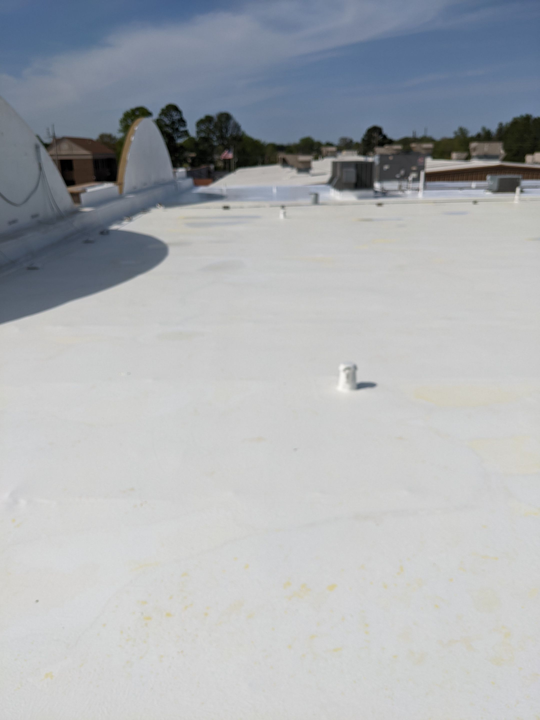 Commercial Roofing Installation using Aldocoat Coatings by Hostetler Roofing