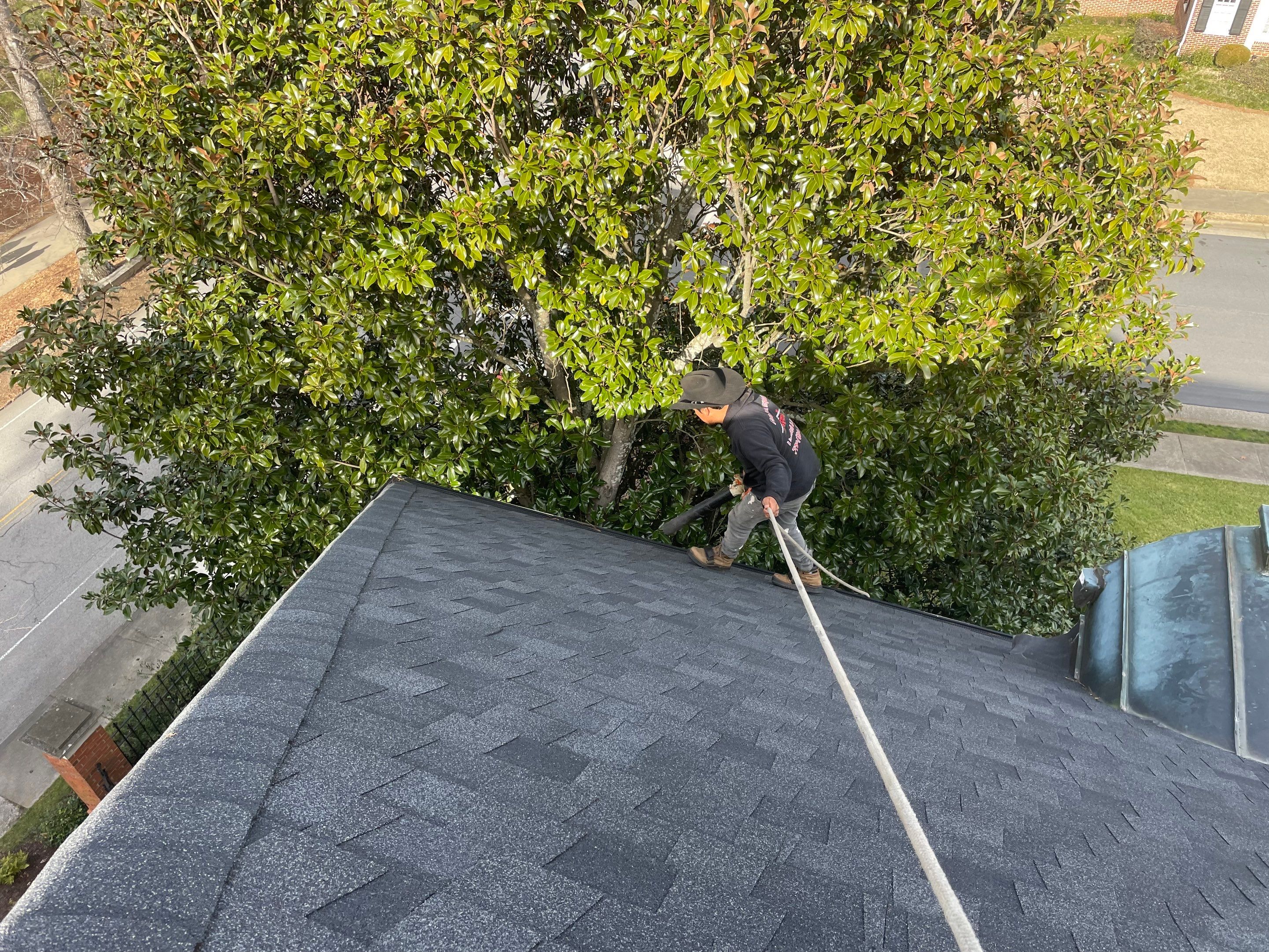 Cleaning Gutters  by Deerfield Roofing LLC