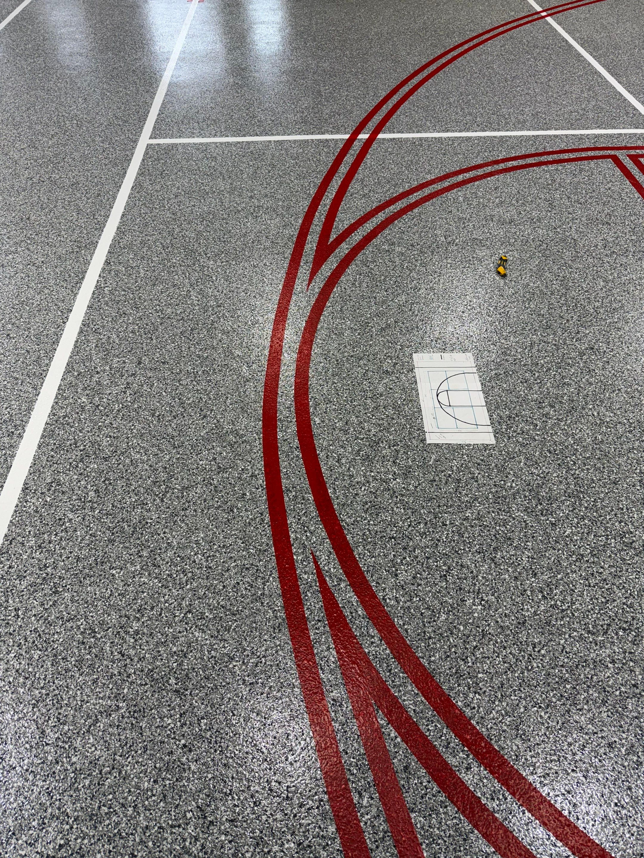 Custom Polyurea Shop Floor with Basketball Court Lines in Rock Valley by Select Painting, Coatings & Garage Cabinets