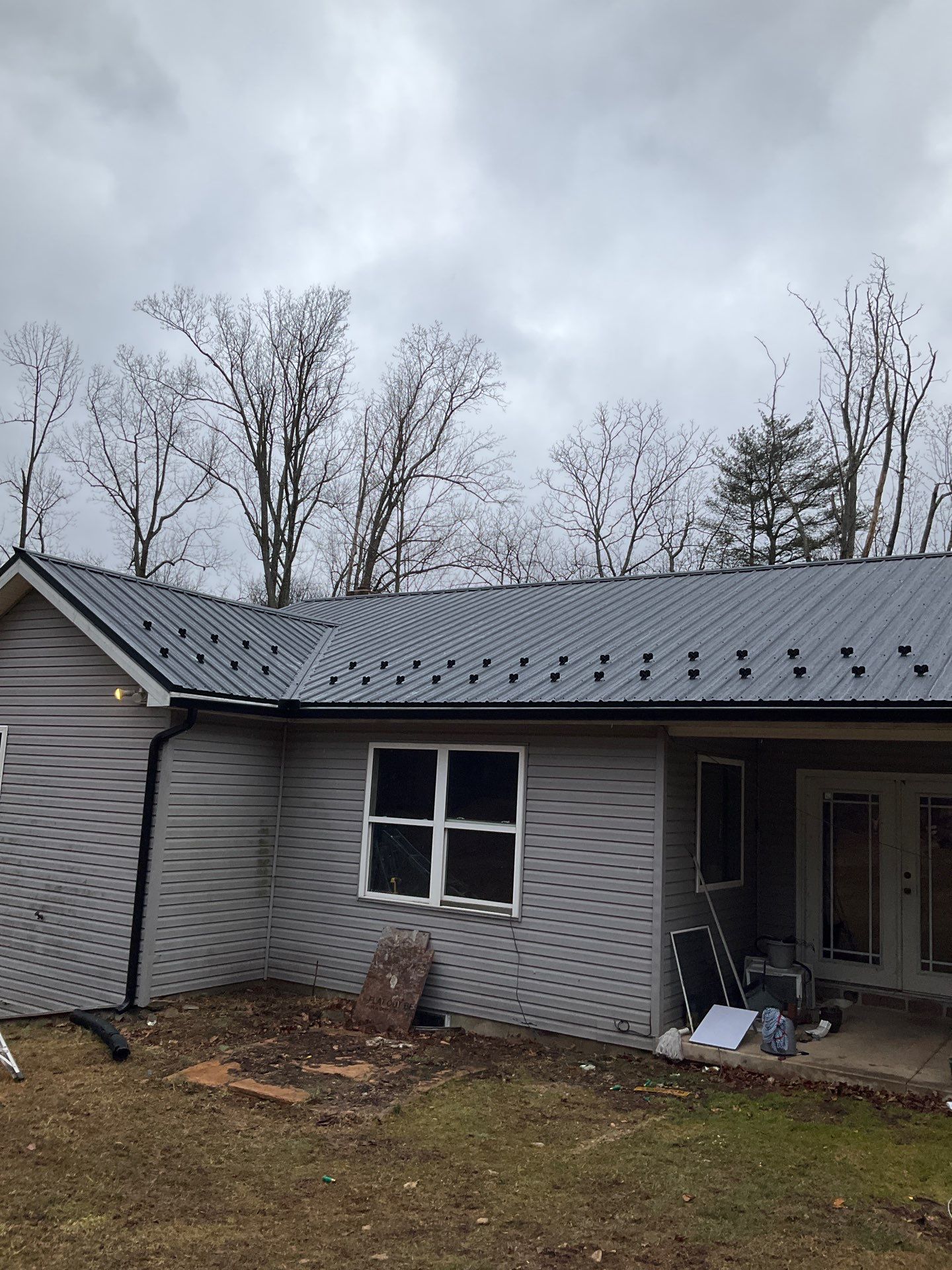 Black Metal Roof Replacement and Gutter Installation in Halifax by Esh Builders