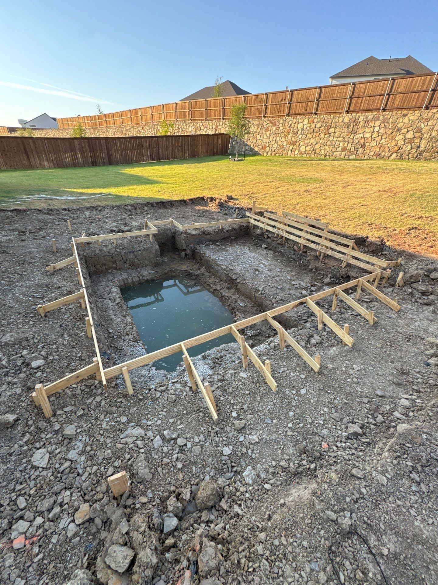 Geometric Pool and Spa with Dark Pebble Interior by Pinnacle Pools and Spas - DFW