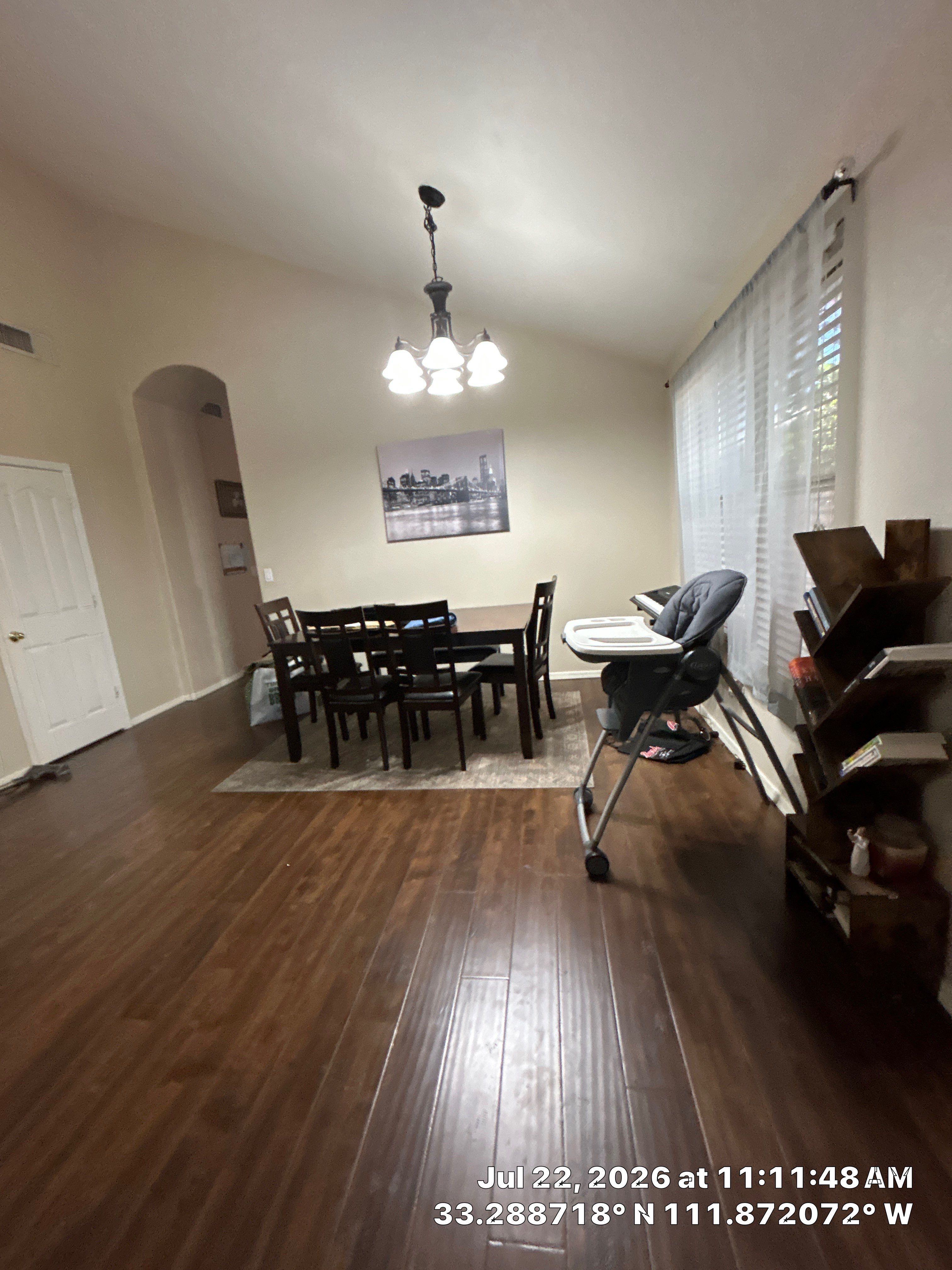 Chandler Dining Room Floor Remodel with Dark Wood-Look Laminate by CompanyCam Sales Demo