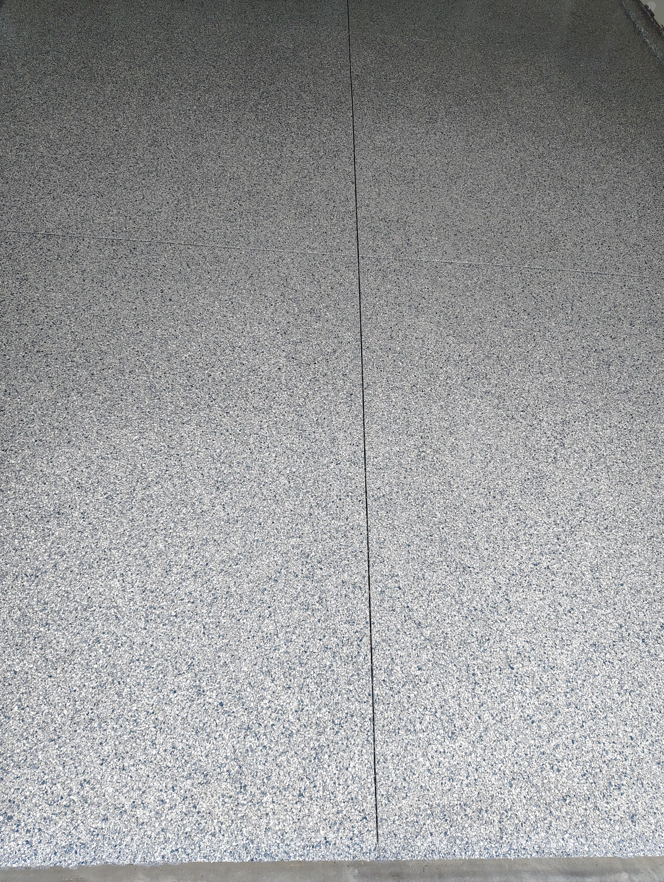 Custom Epoxy Garage Floor Coating Installation in Sioux Falls by Select Painting, Coatings & Garage Cabinets