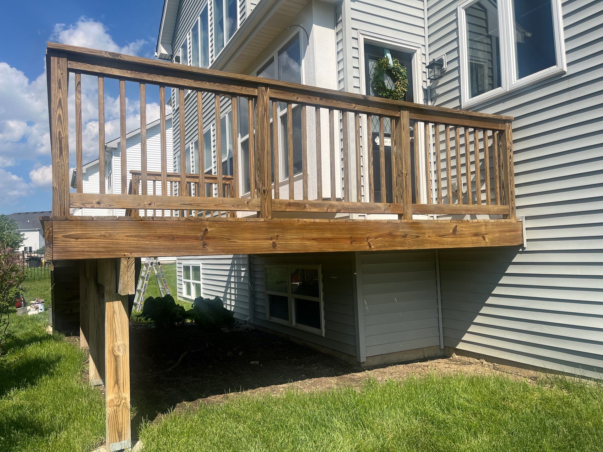 wood deck cleaning and staining by Northern Power Washing LLC.