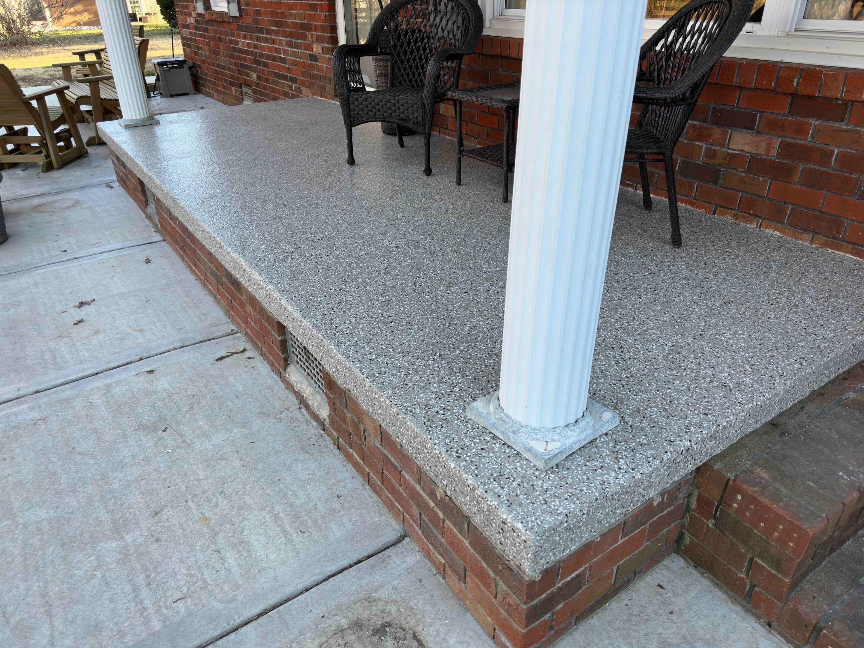 Front Porch and Garage using Creekbed by Elite Floor Solutions