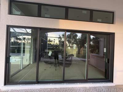 Window Installation using PGT Vinyl White-Bronze