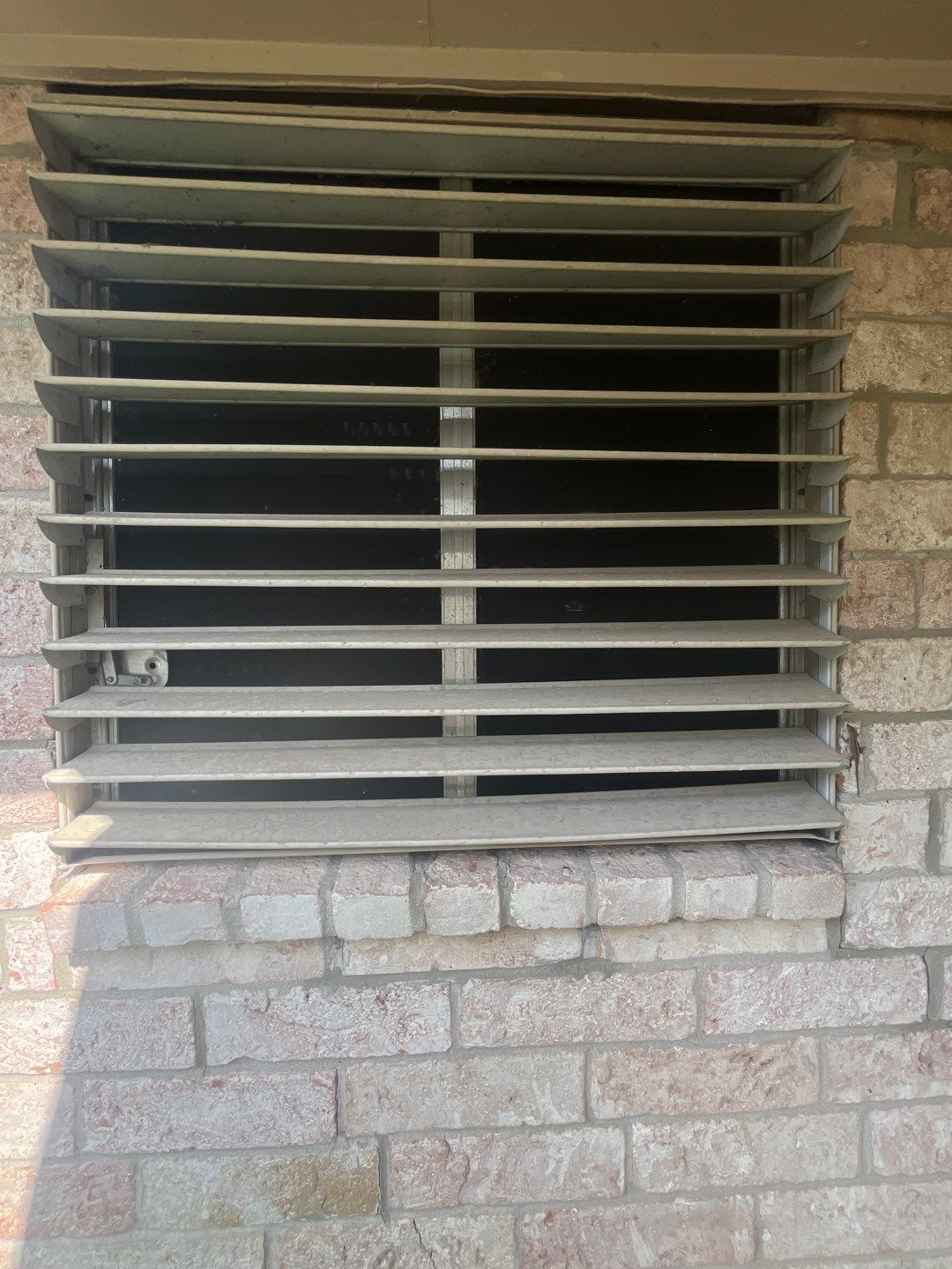 Colored Vinyl Windows to blend into brick by Bayfront Roofing and Construction