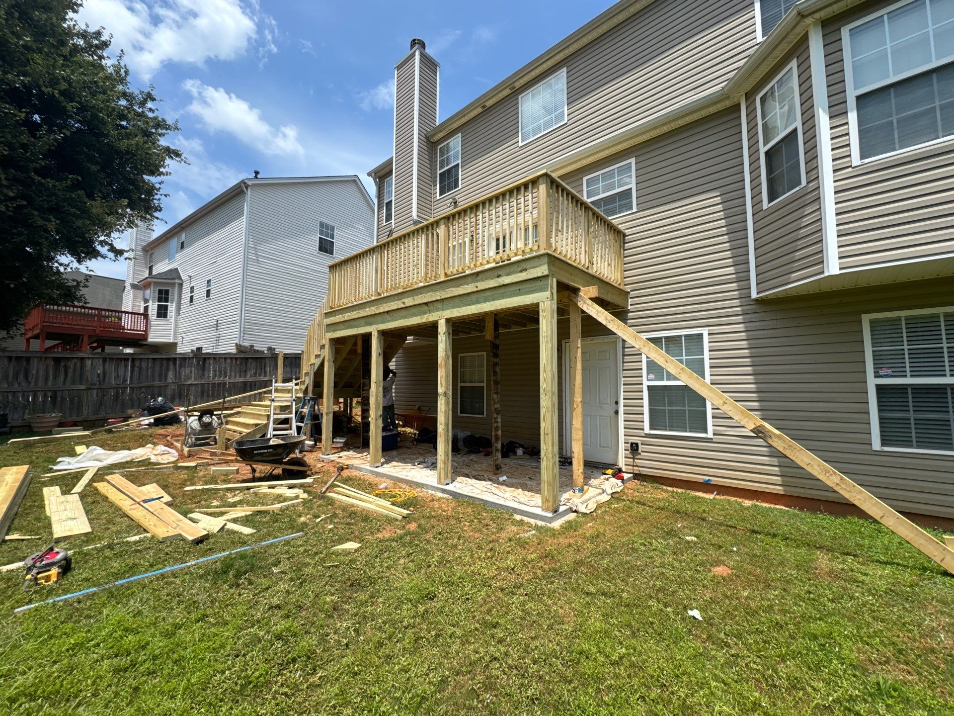 Backyard Deck Expansion & Custom Staircase Installation in Suwanee. by Swift Home Renovations