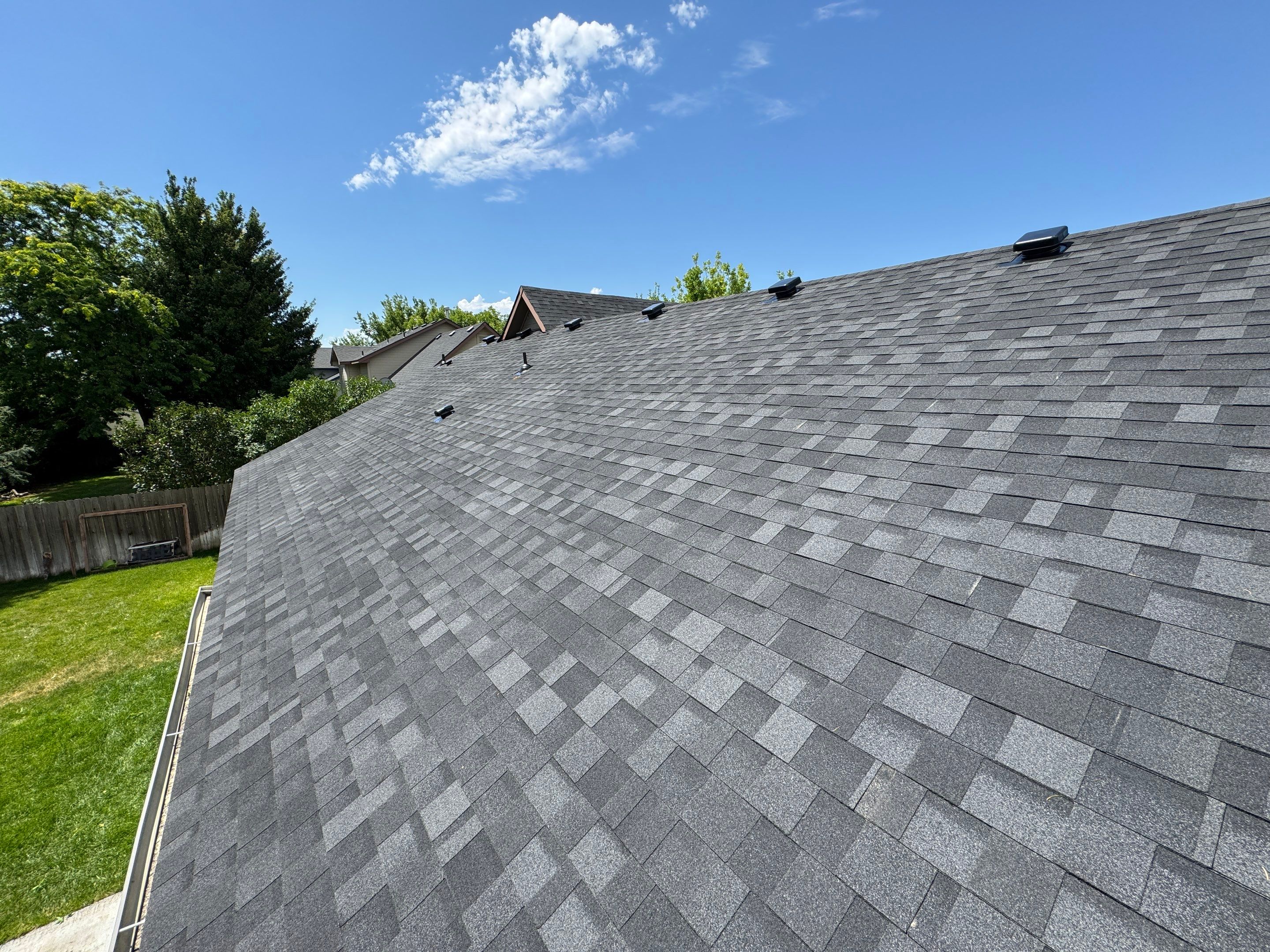 Residential Roof Replacement Featuring Charcoal Grey Architectural Shingles by Olive Roofing