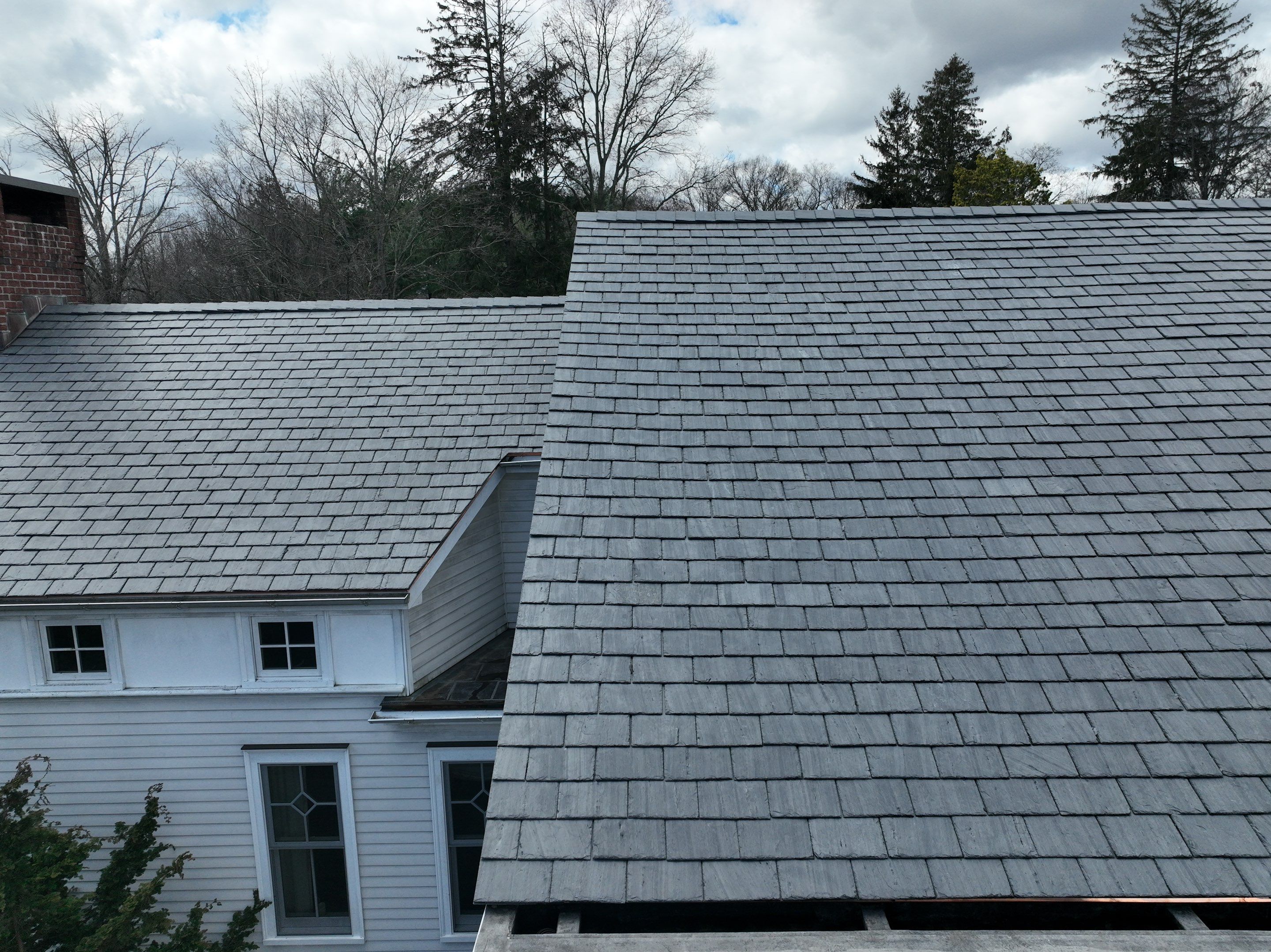 Residential Roofing Installation using Vermont Slate by A Plus Exterior
