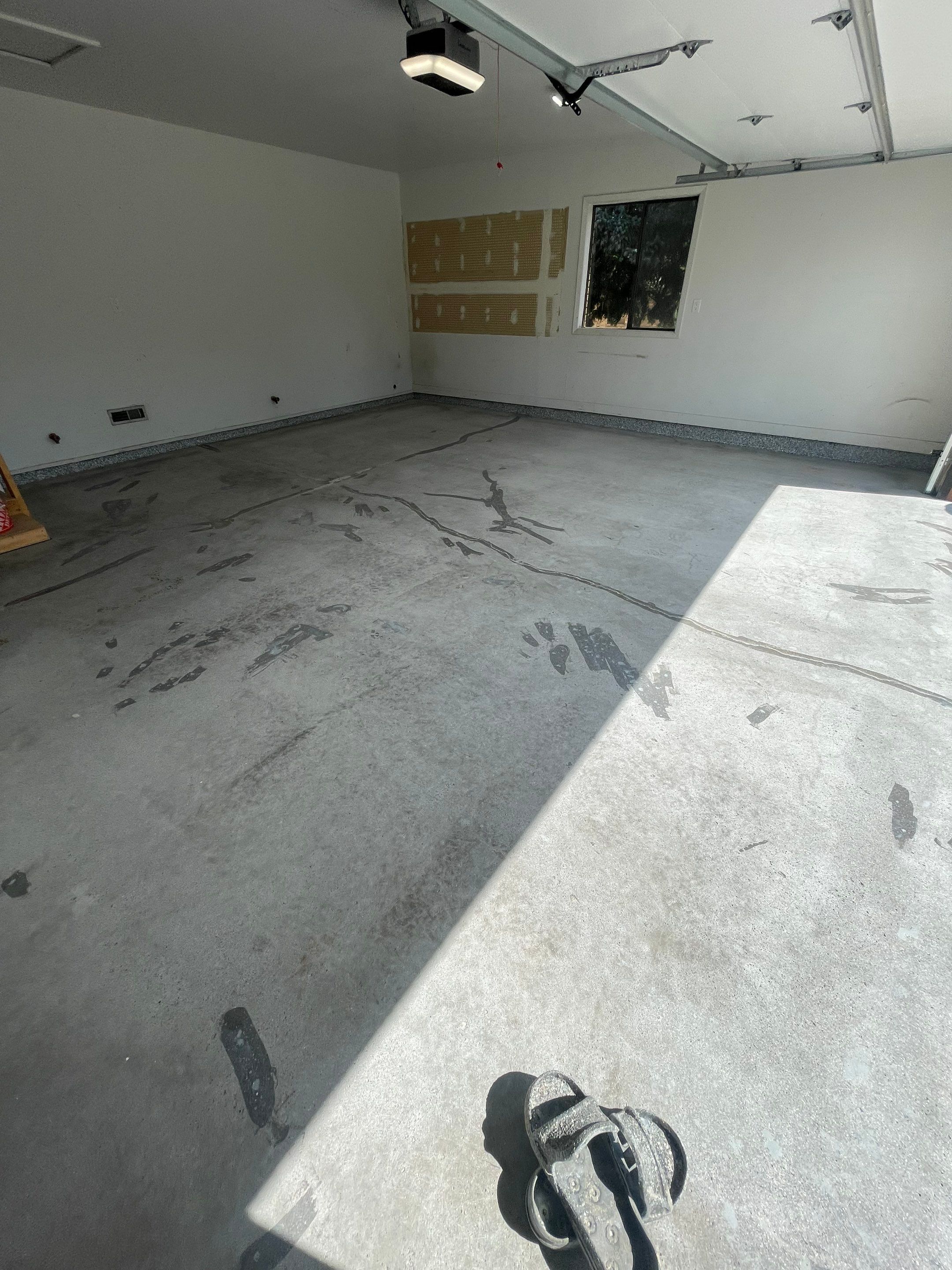 Grey Speckled Concrete Coating for Residential Garage in Yankton by Select Painting, Coatings & Garage Cabinets