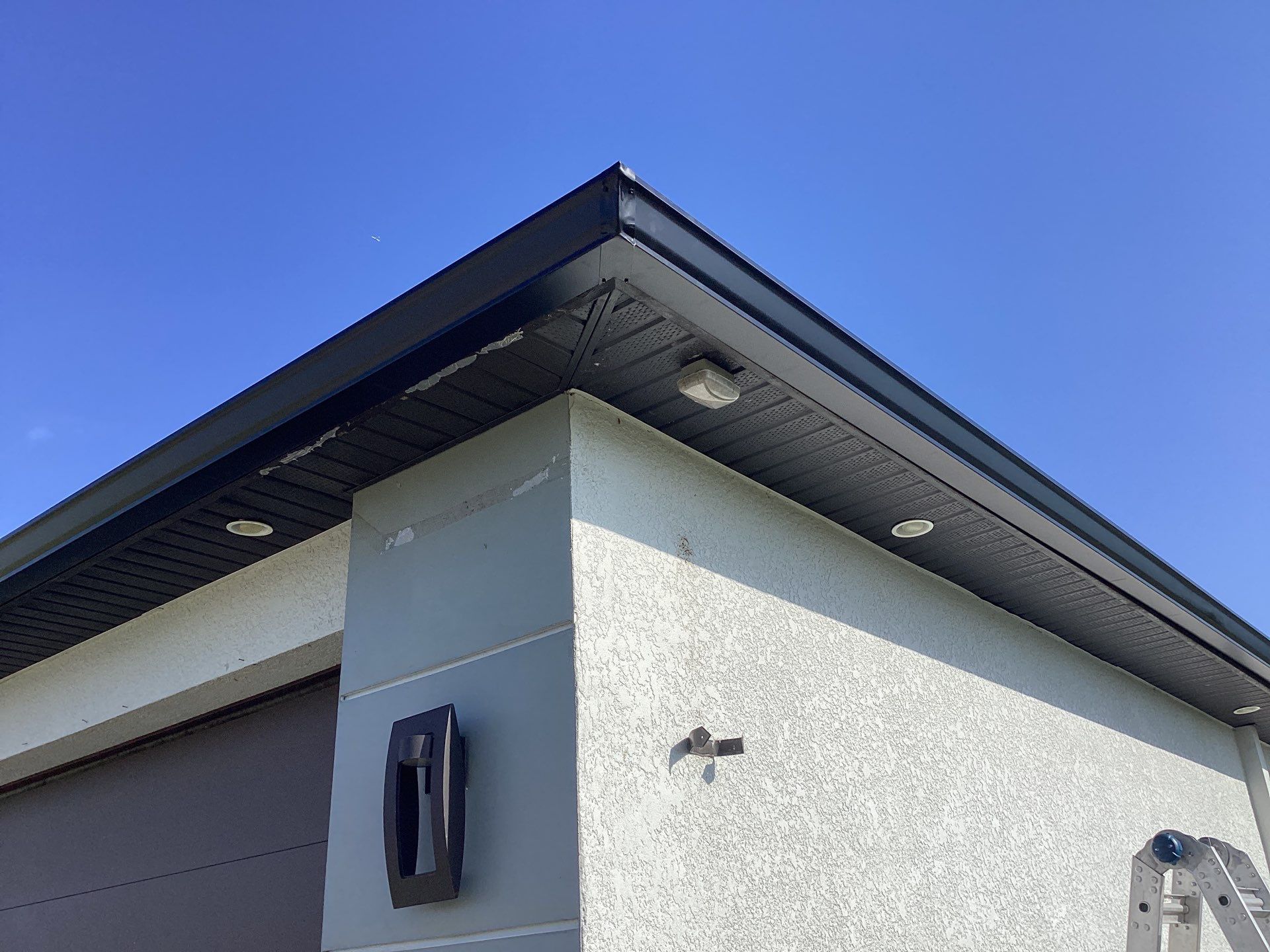 Black Seamless Gutters using 6 Inch Seamless Gutters in Cape Coral FL by Gutter Professors
